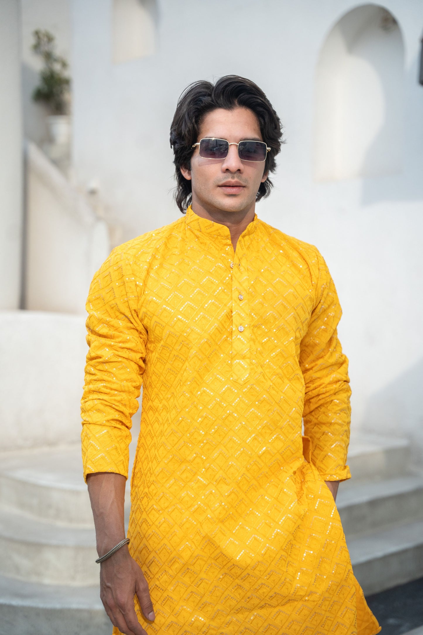 Indian men in yellow embroidery work kurta