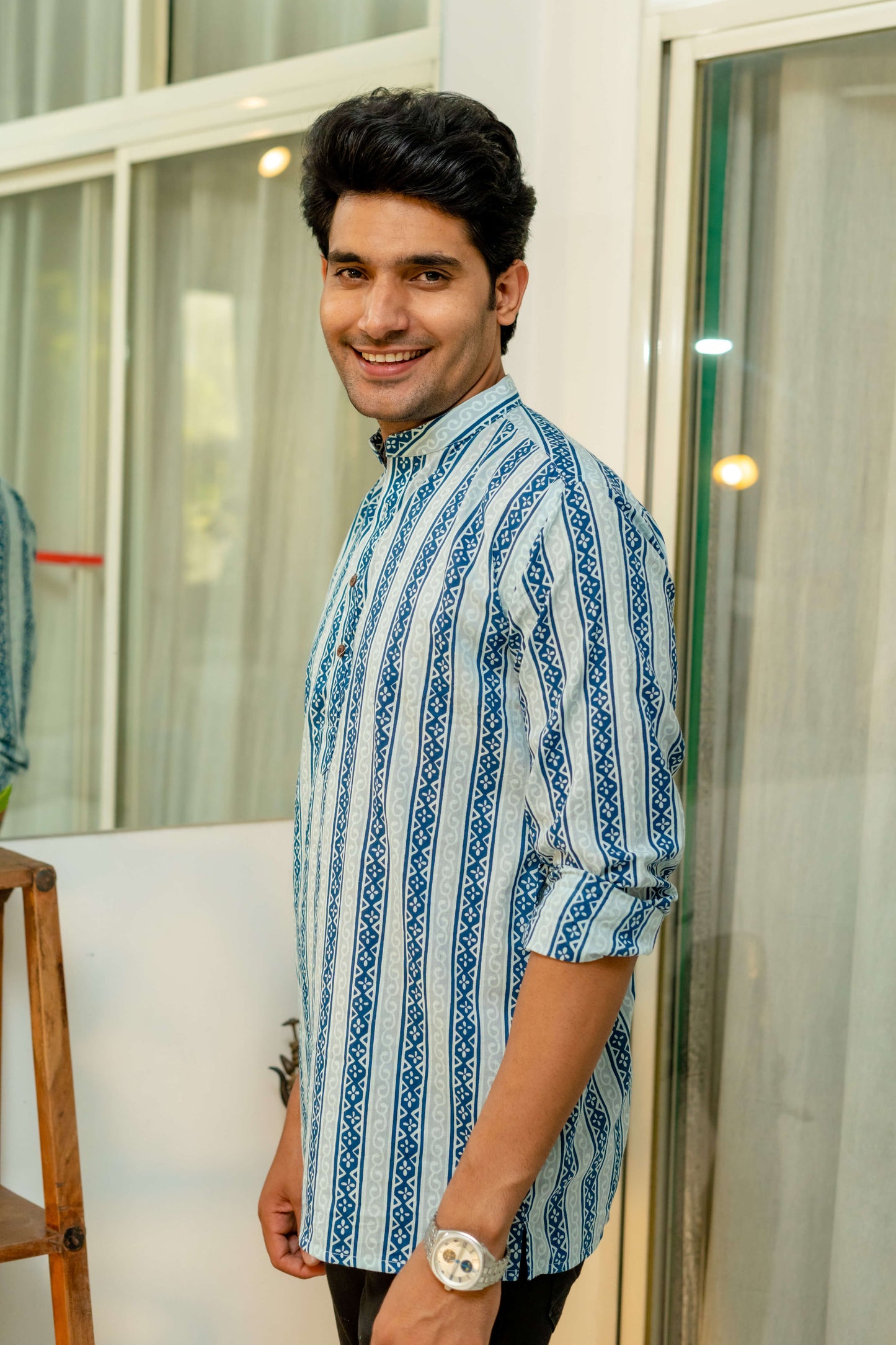 Indian man wearing blue short kurta