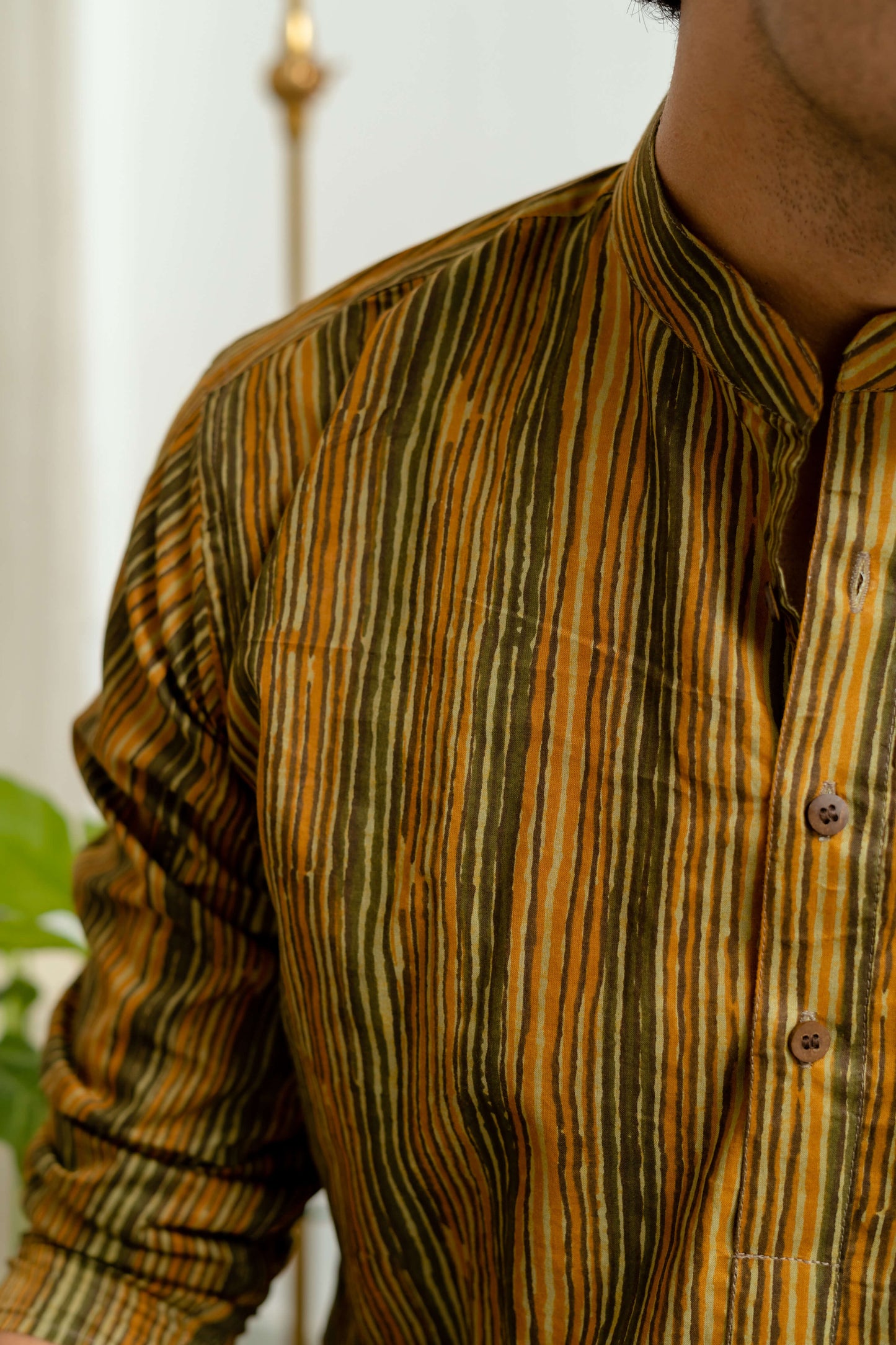 Close-Up View of Mustard and Green Stripe Printed Short Kurta for Men