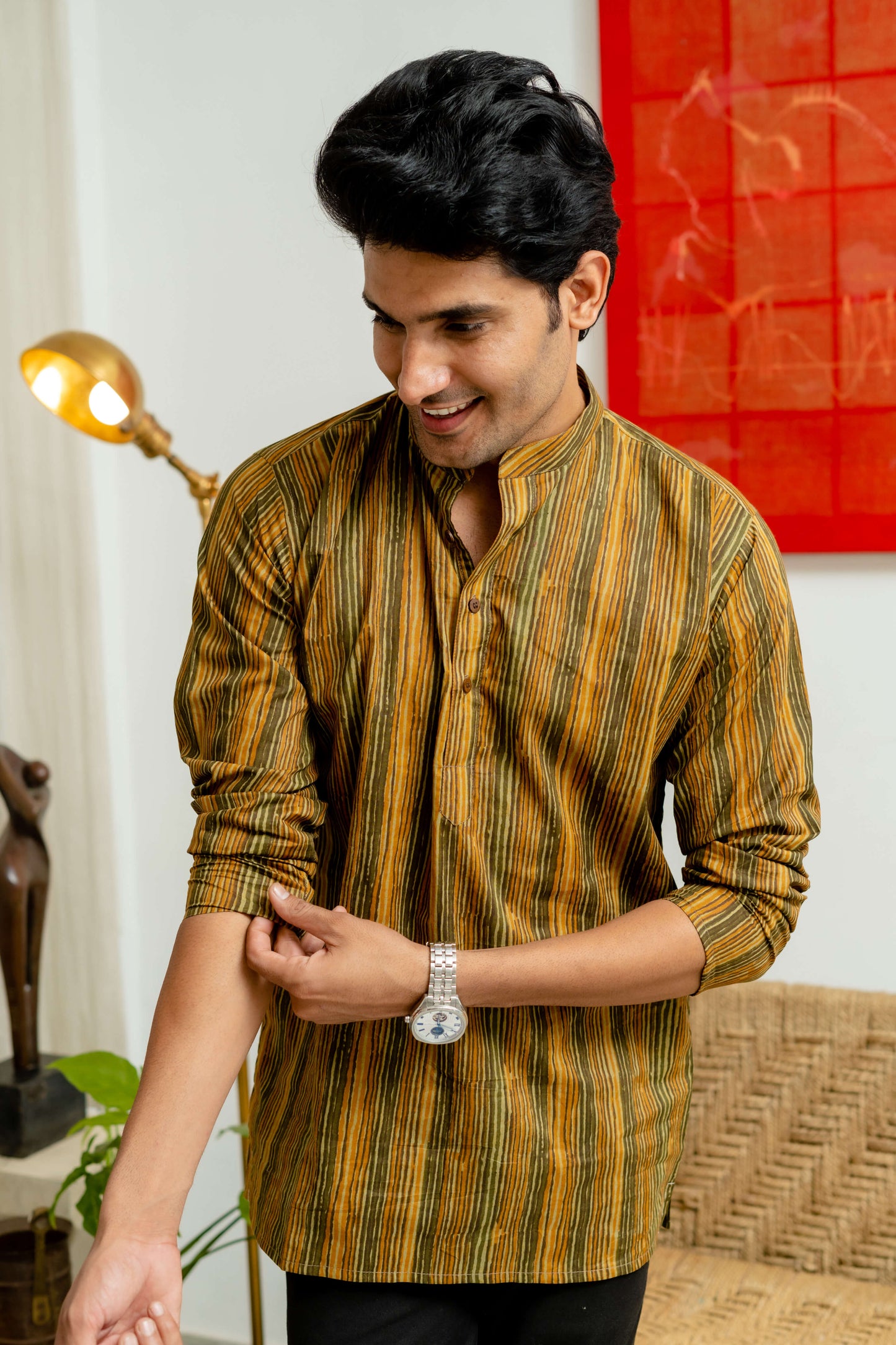 An Indian Men Wearing Mustard and Olive Green Tribal Stripe Print Short Kurta