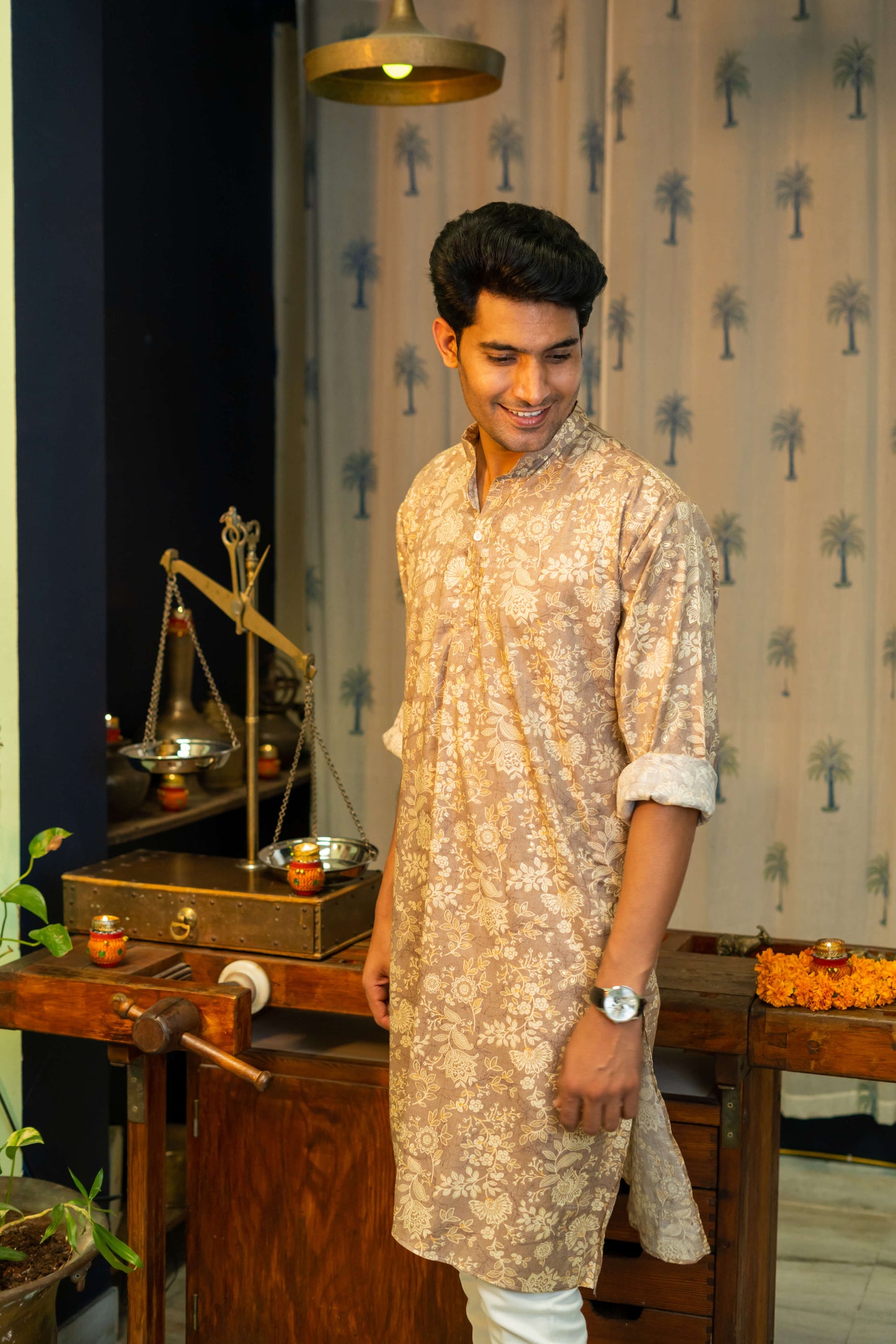 Man Giving Pose for the Muslin Slub Long Kurta in Light Brown and Off-White Floral Print