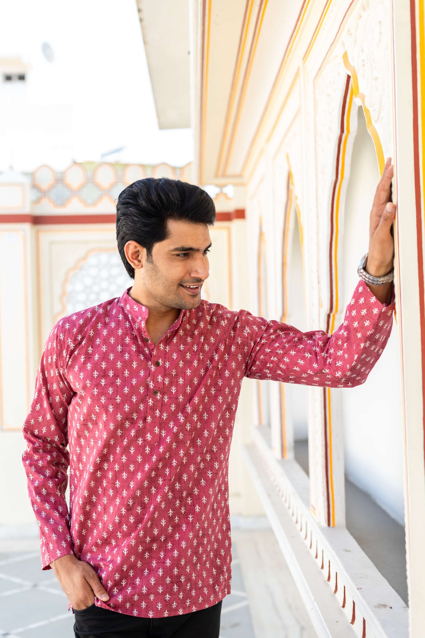 An indian man wearning color kurta