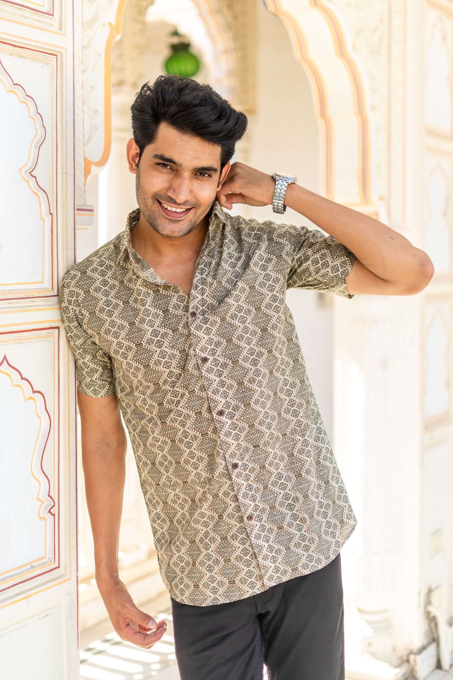 An Indian Man Wearing Olive Green Tribal Print Shirt