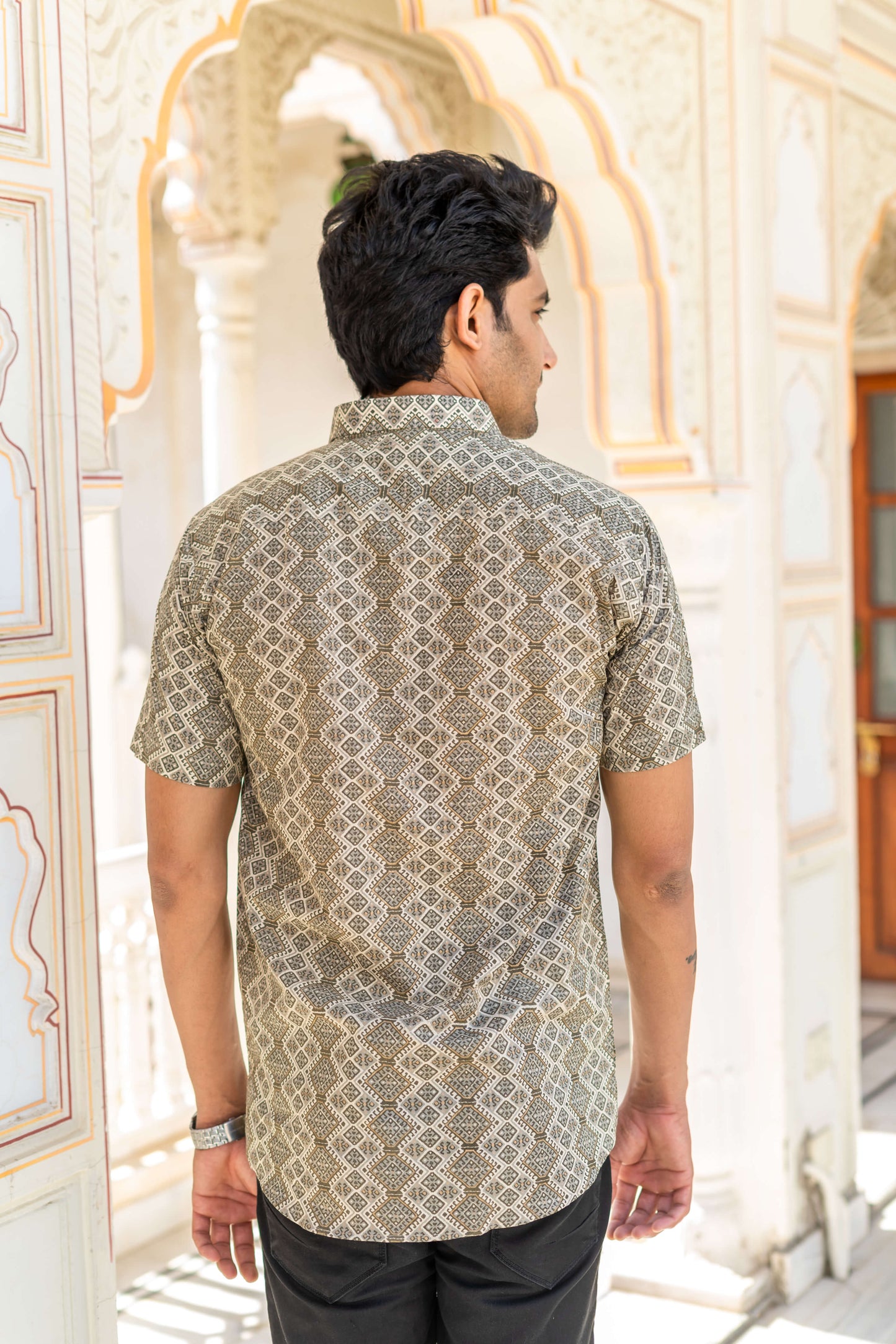 Indian Man Wearing Printed Shirt and Showing Back Prints for The Shirt