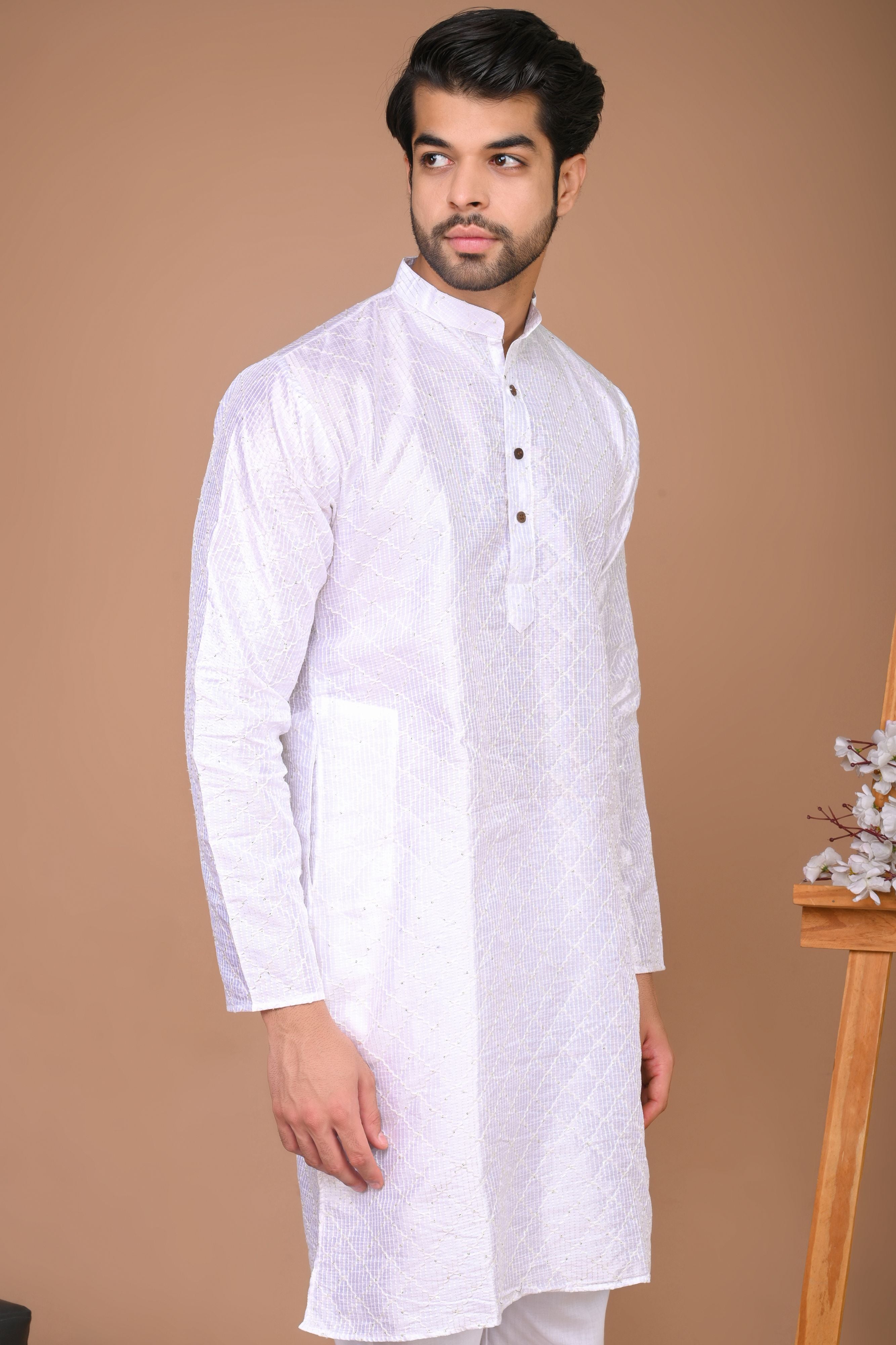 The White long Kurta with embroidery and sequins work
