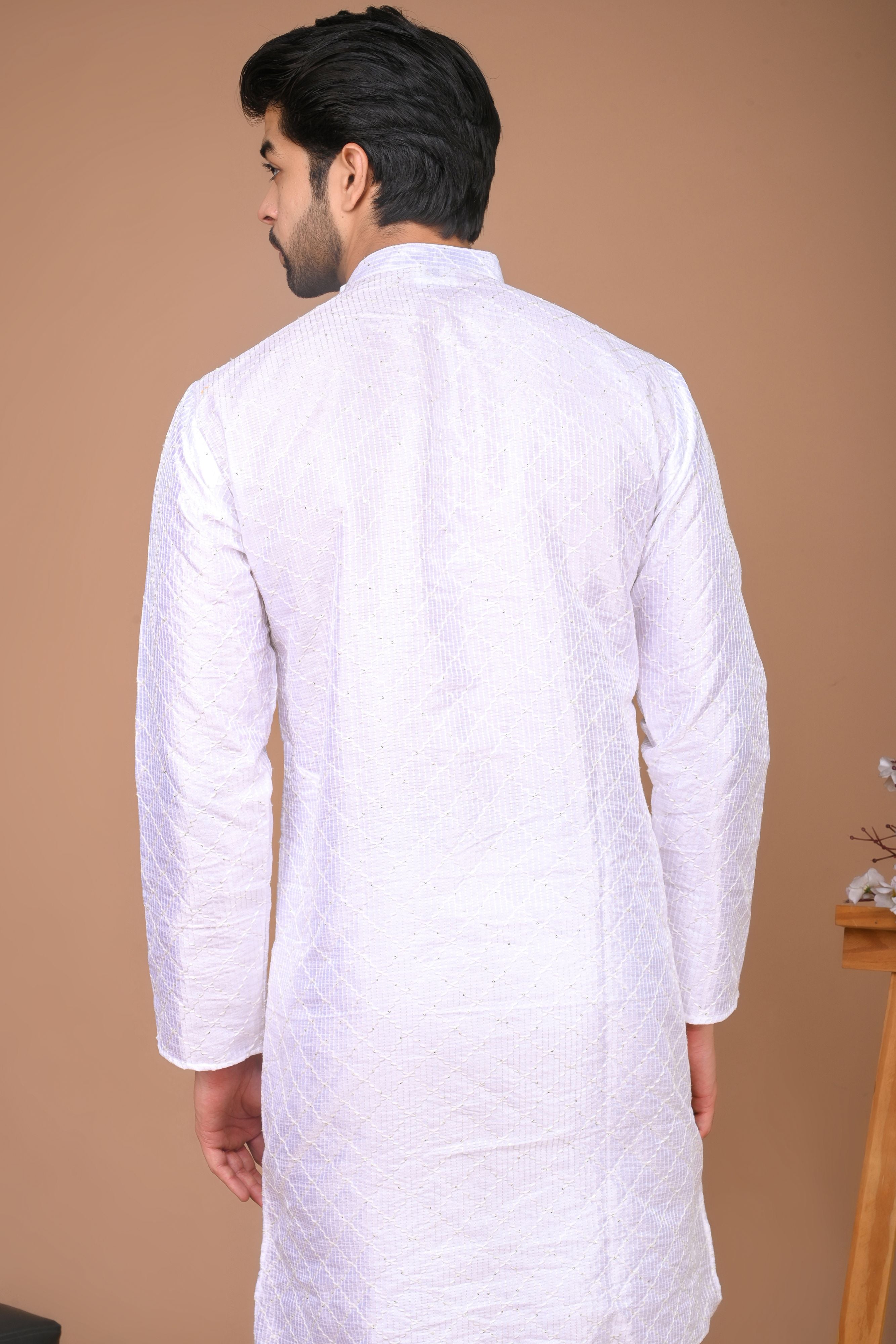 The White long Kurta with embroidery and sequins work