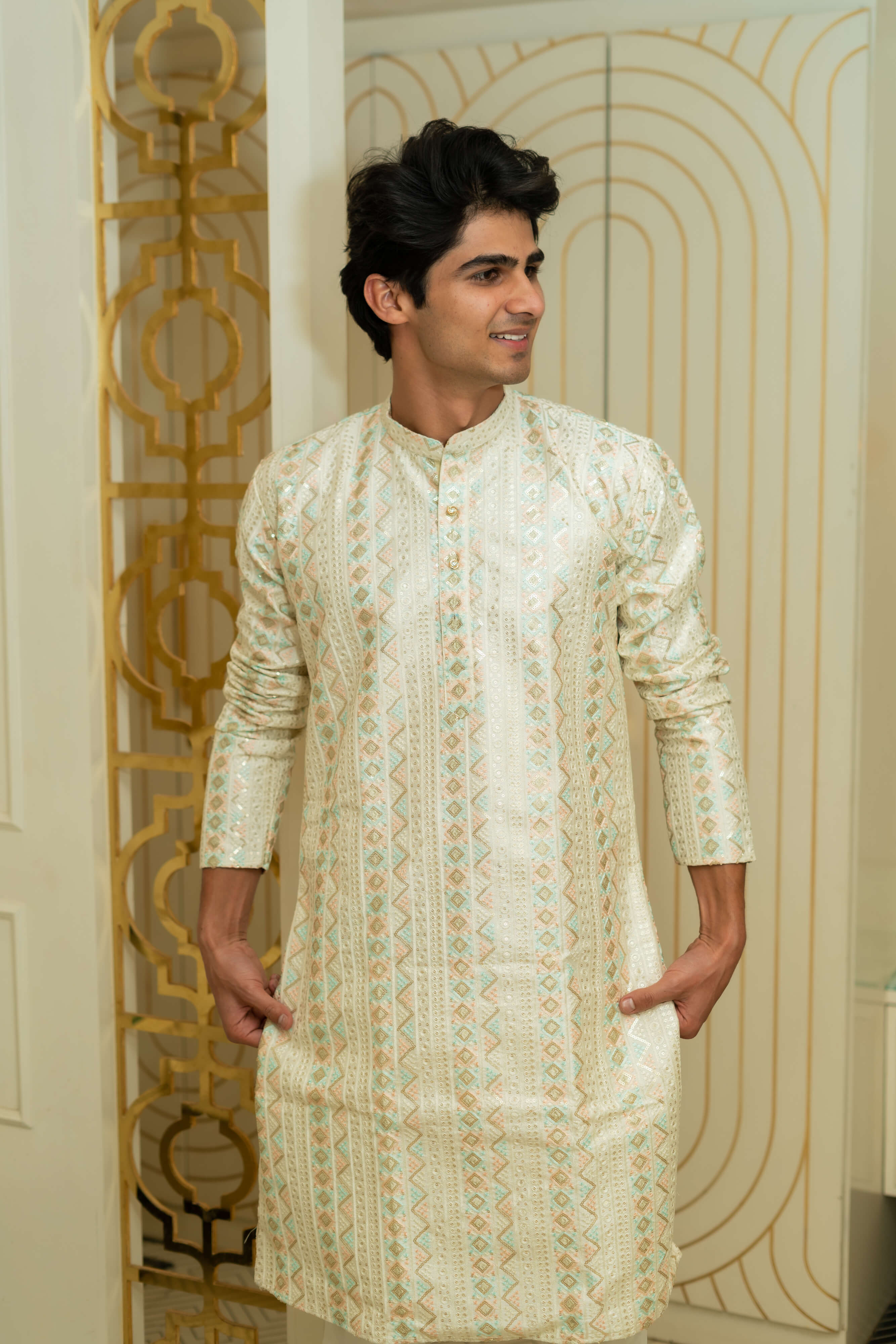 The Heavy Off-White Long Kurta With Tribal Stripe Thread Work And Sequins