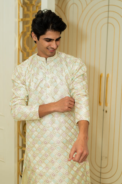 The Heavy Off-White Long Kurta With Pink And Blue Thread Work And Sequins