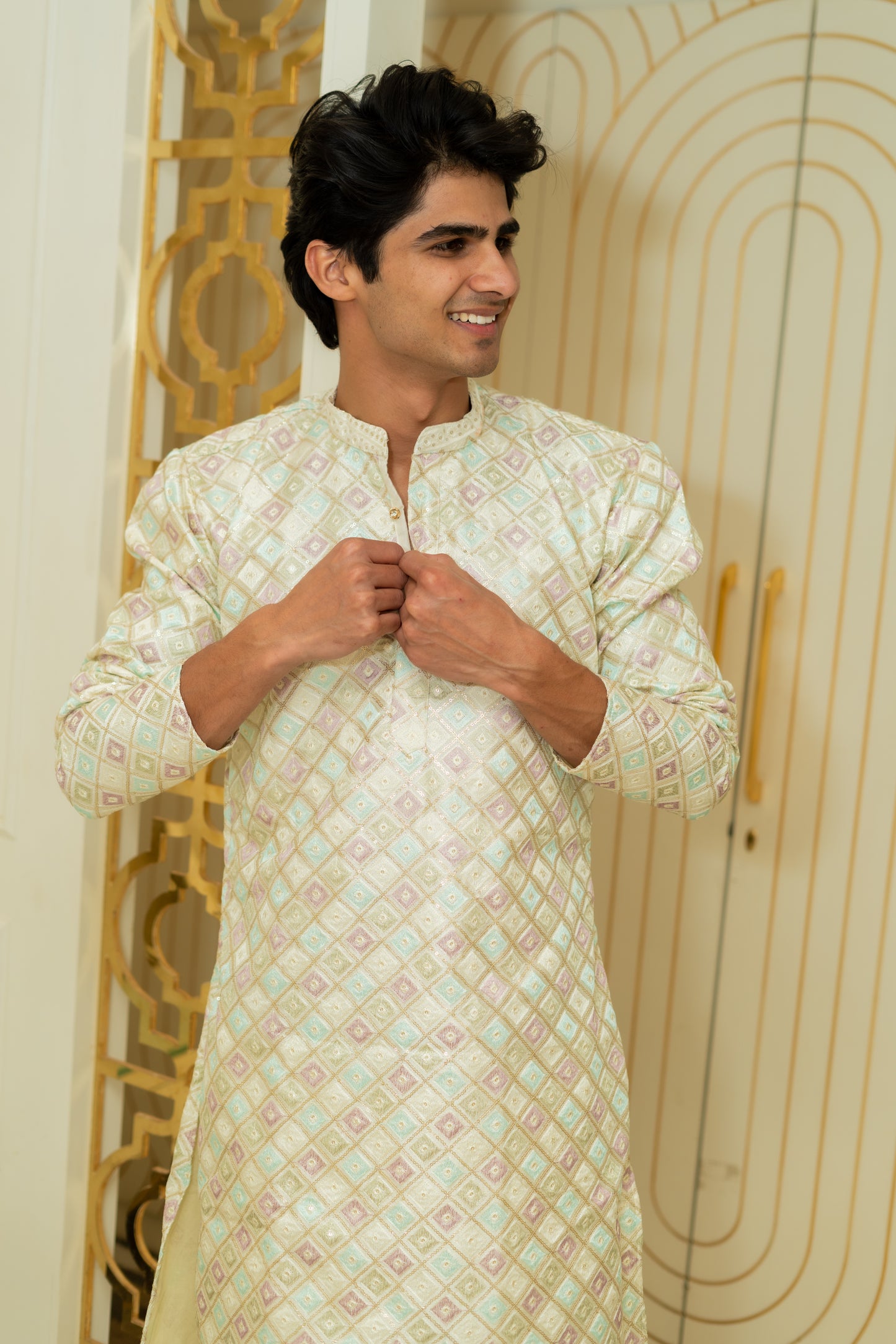 The Heavy Off-White Long Kurta With Pink And Blue Thread Work And Sequins