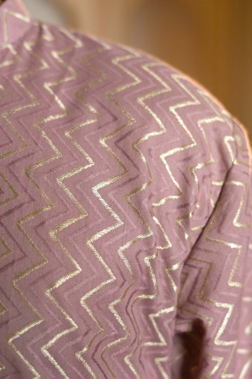The Golden Zigzag Embroidery Work Long Kurta In Light Purple Color