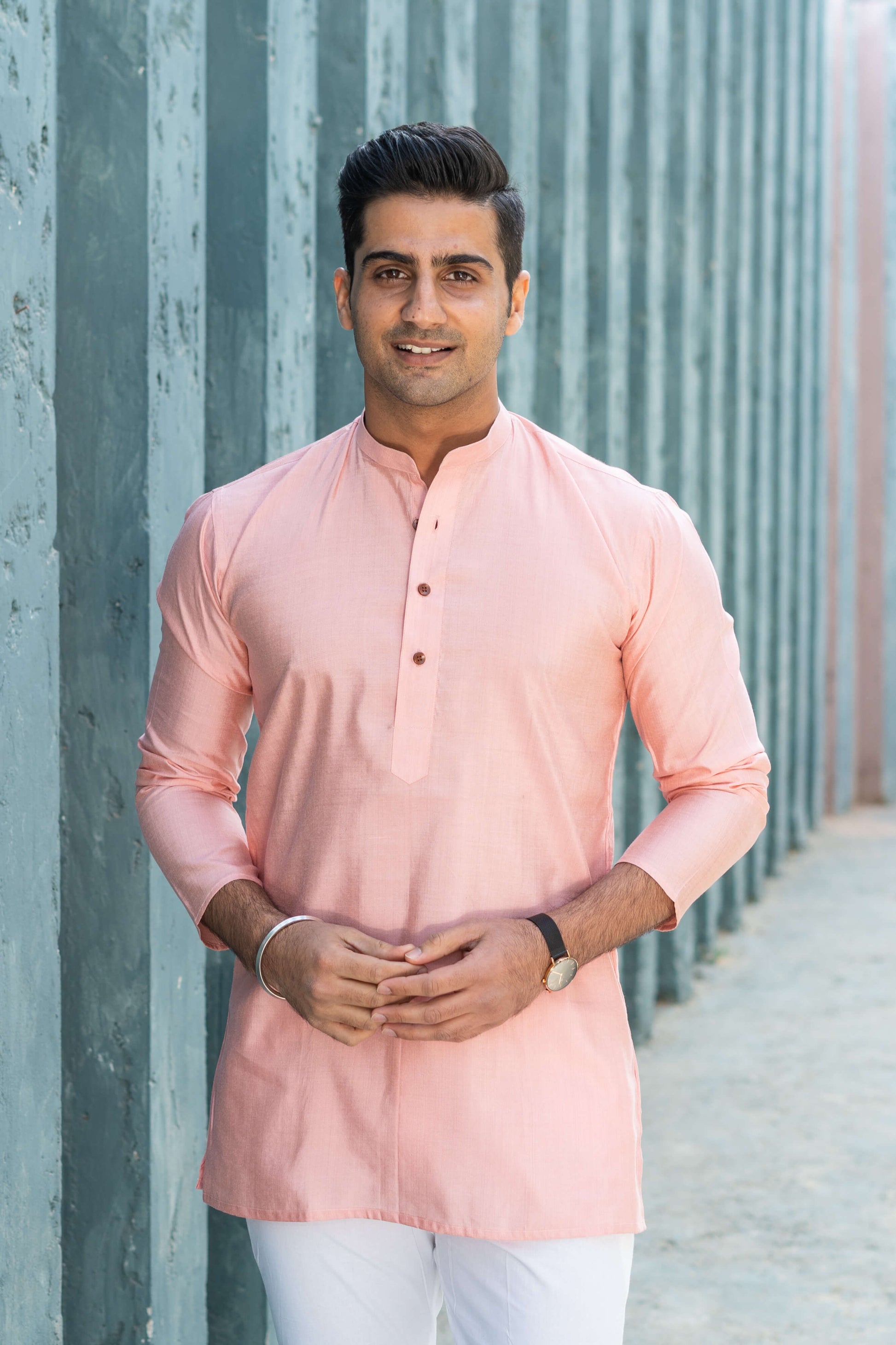 Indian man wearing pink short kurta for men