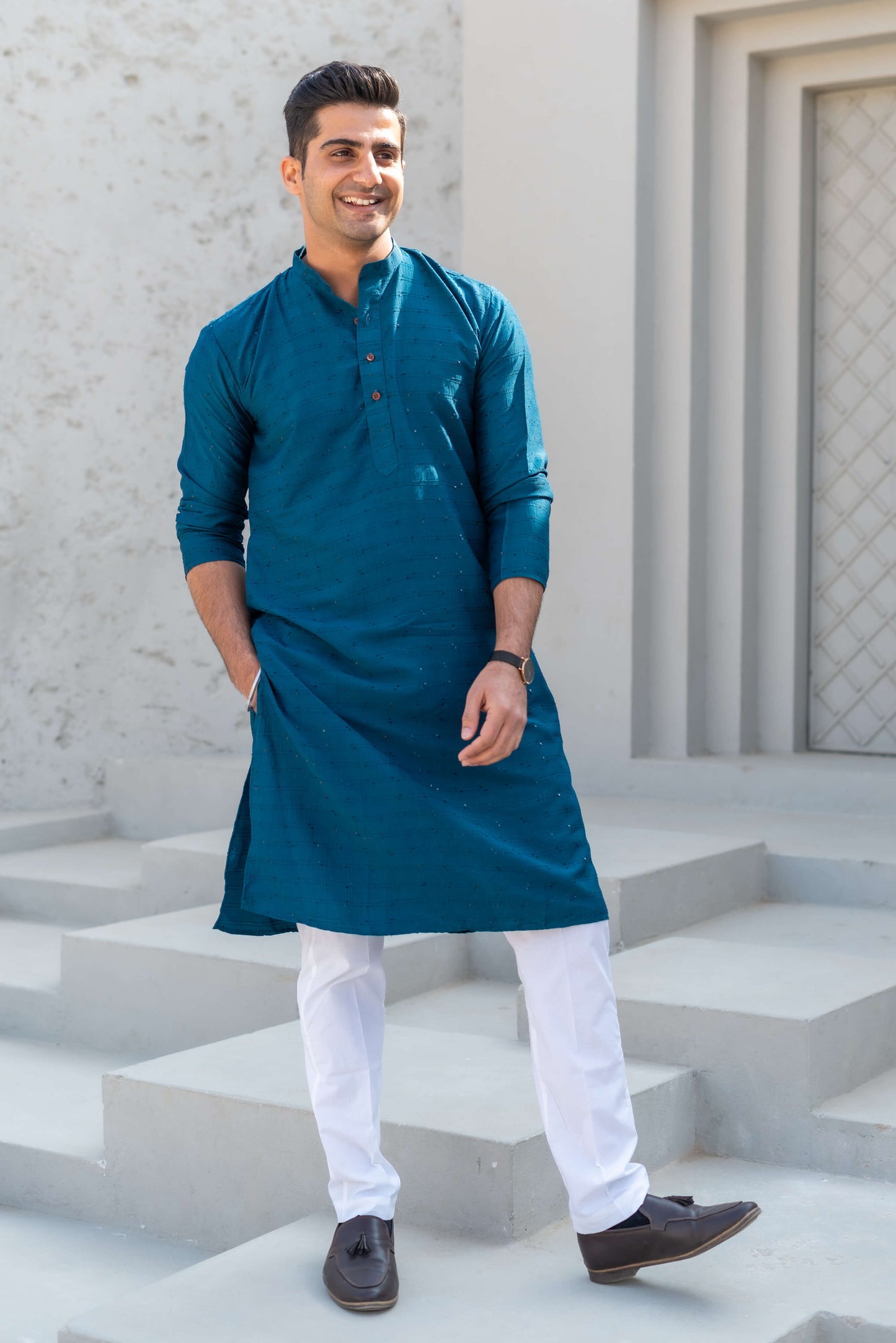 An Indian Men Wearing Blue Color Long Kurta and White Pajama. 