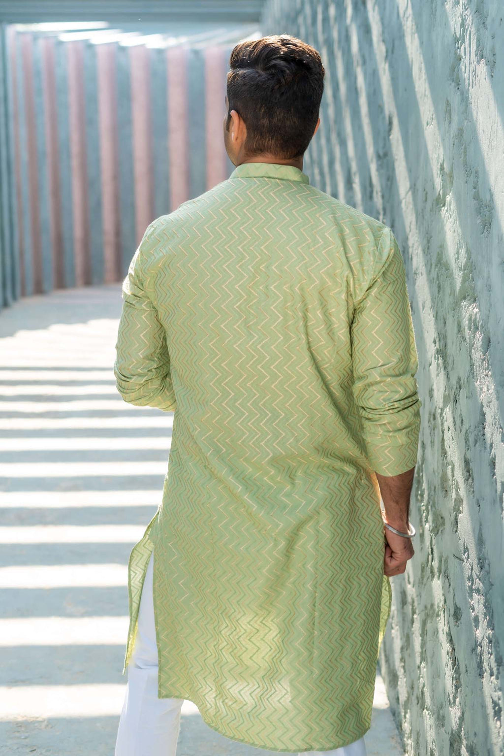 The Golden Zigzag Embroidery Work Long Kurta In Pastel Green Color