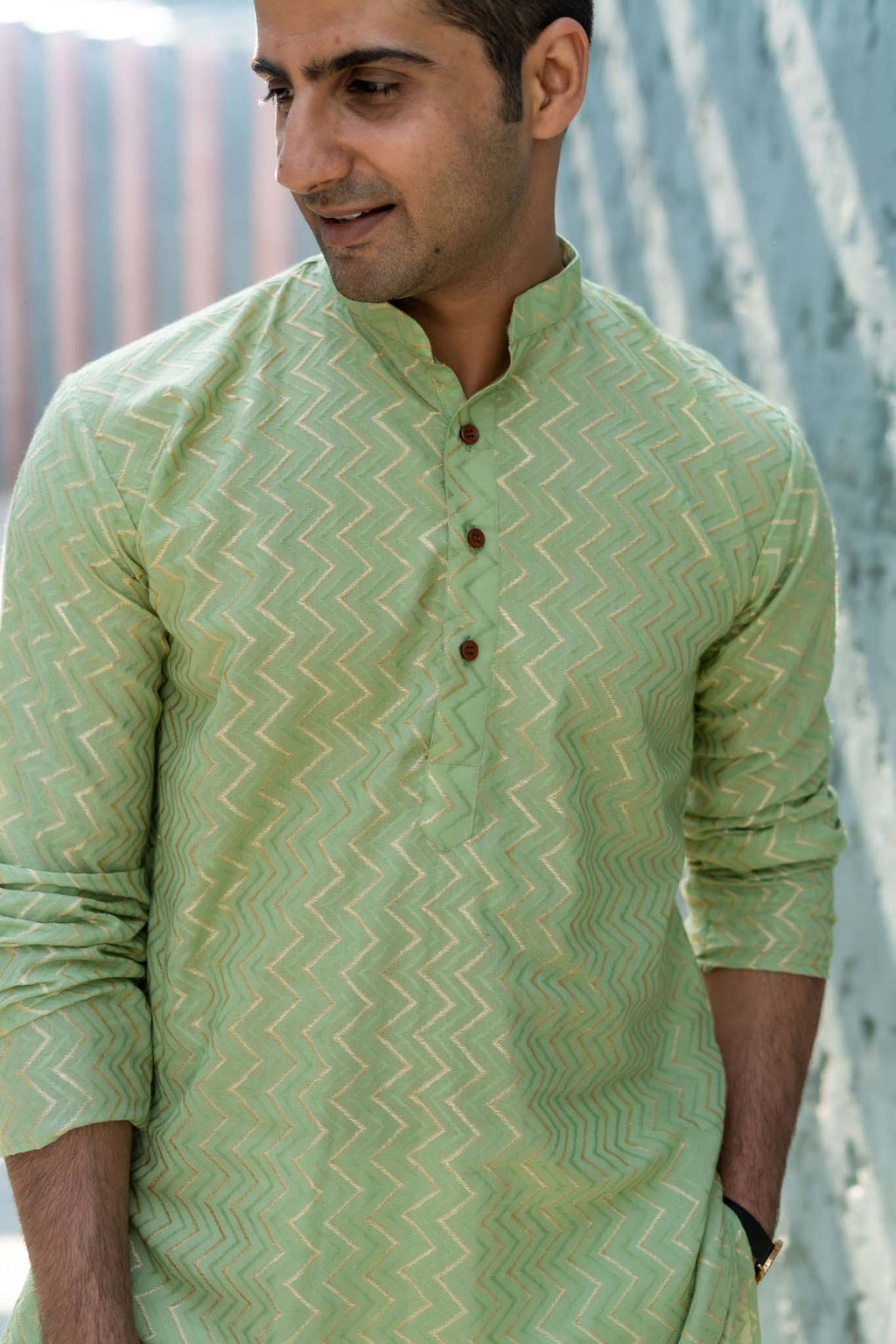 The Golden Zigzag Embroidery Work Long Kurta In Pastel Green Color
