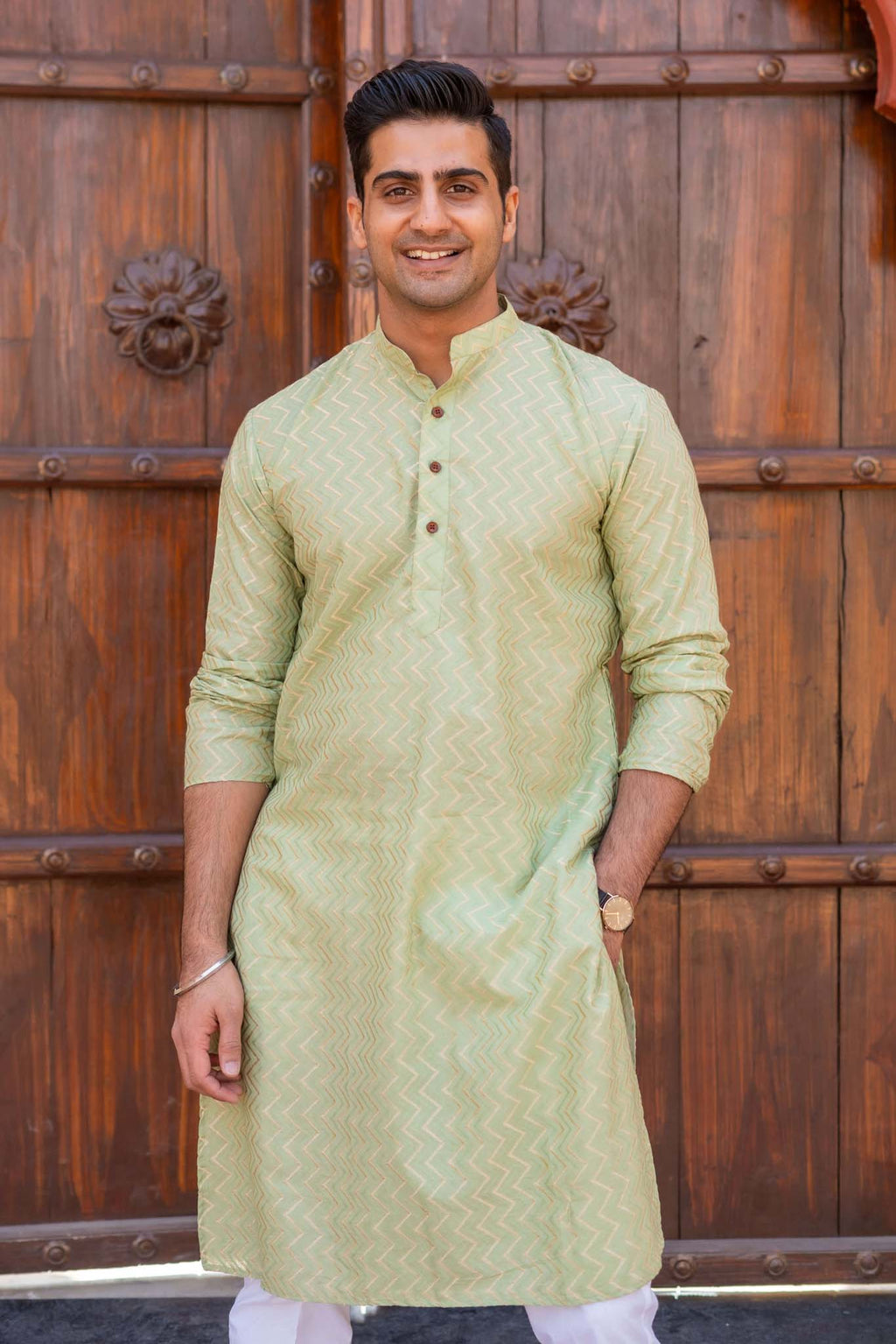 The Golden Zigzag Embroidery Work Long Kurta In Pastel Green Color