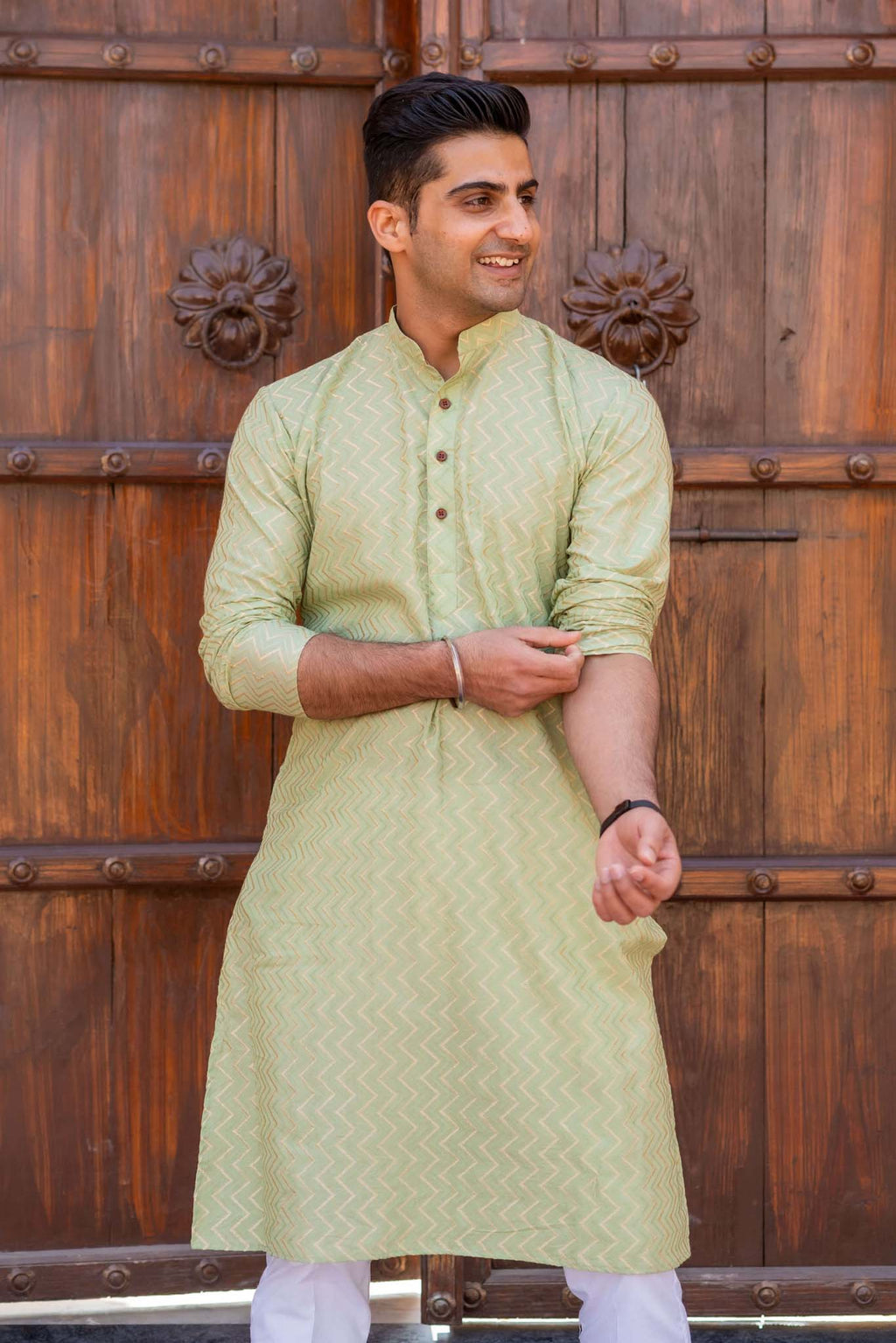 The Golden Zigzag Embroidery Work Long Kurta In Pastel Green Color
