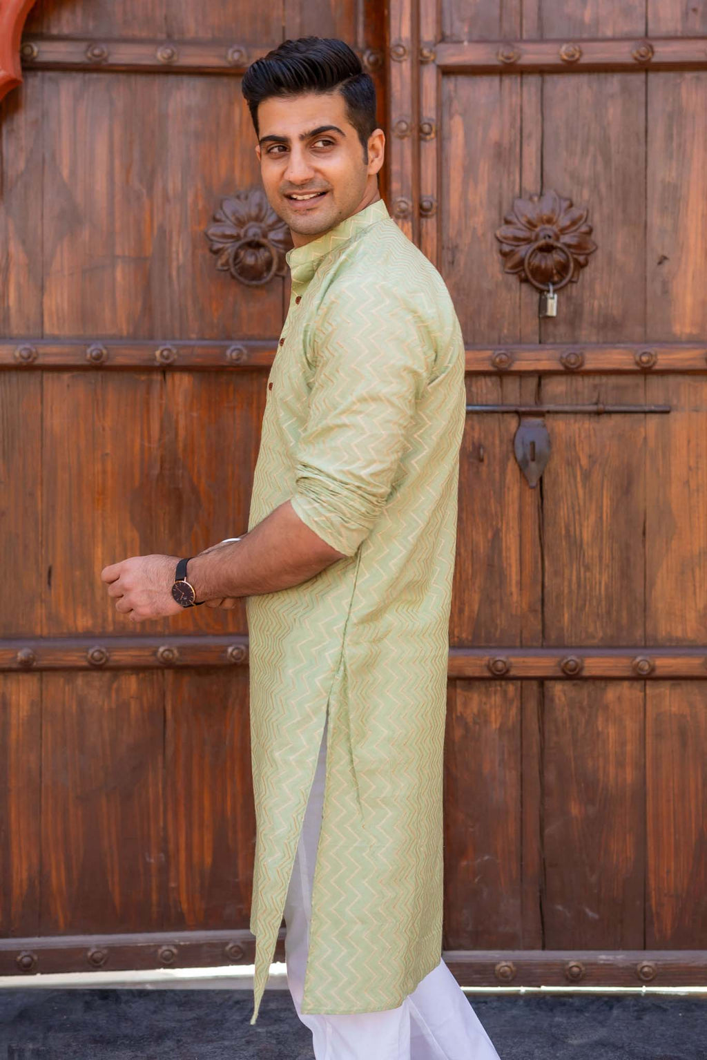 The Golden Zigzag Embroidery Work Long Kurta In Pastel Green Color