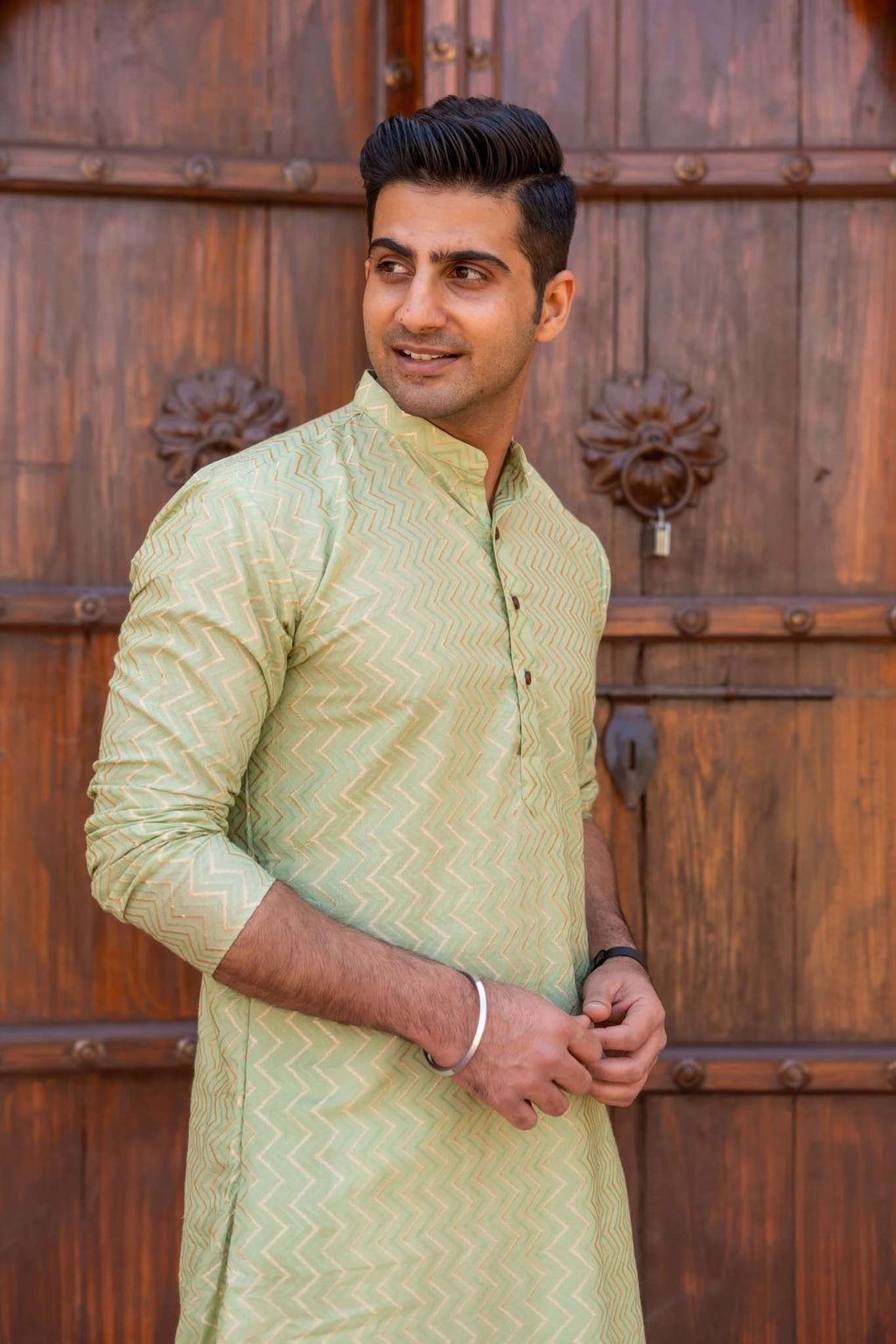 The Golden Zigzag Embroidery Work Long Kurta In Pastel Green Color