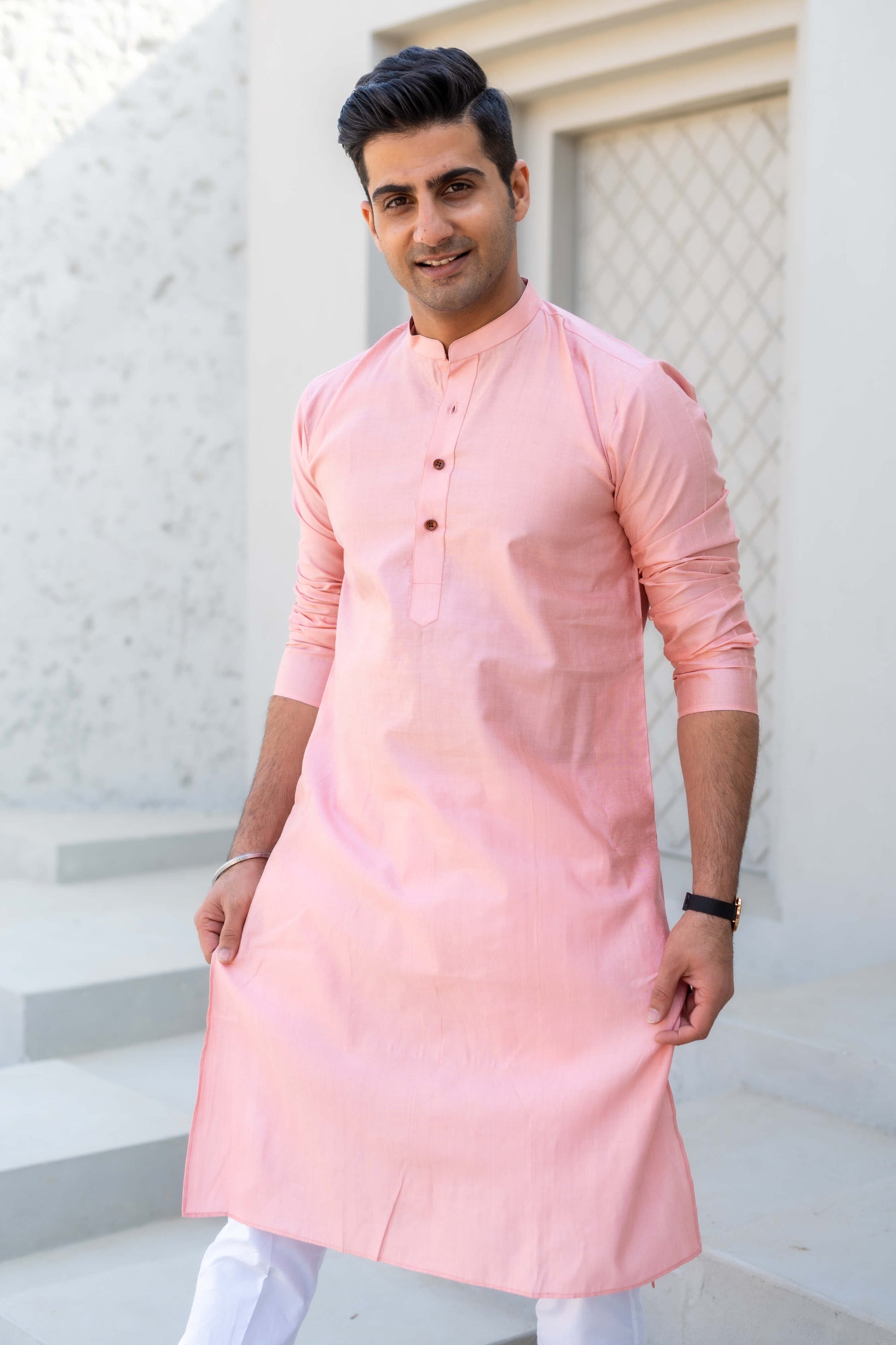 Indian men wearing pink color long kurta