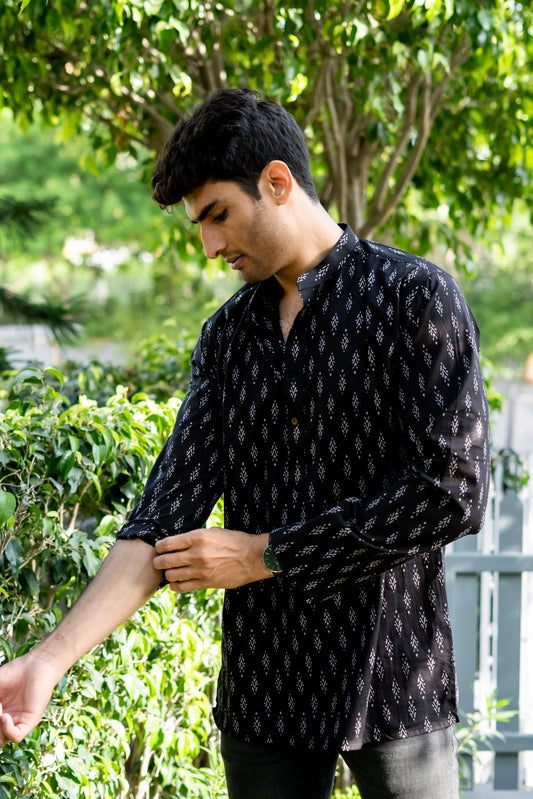 Indian man wearing black short kurta for men