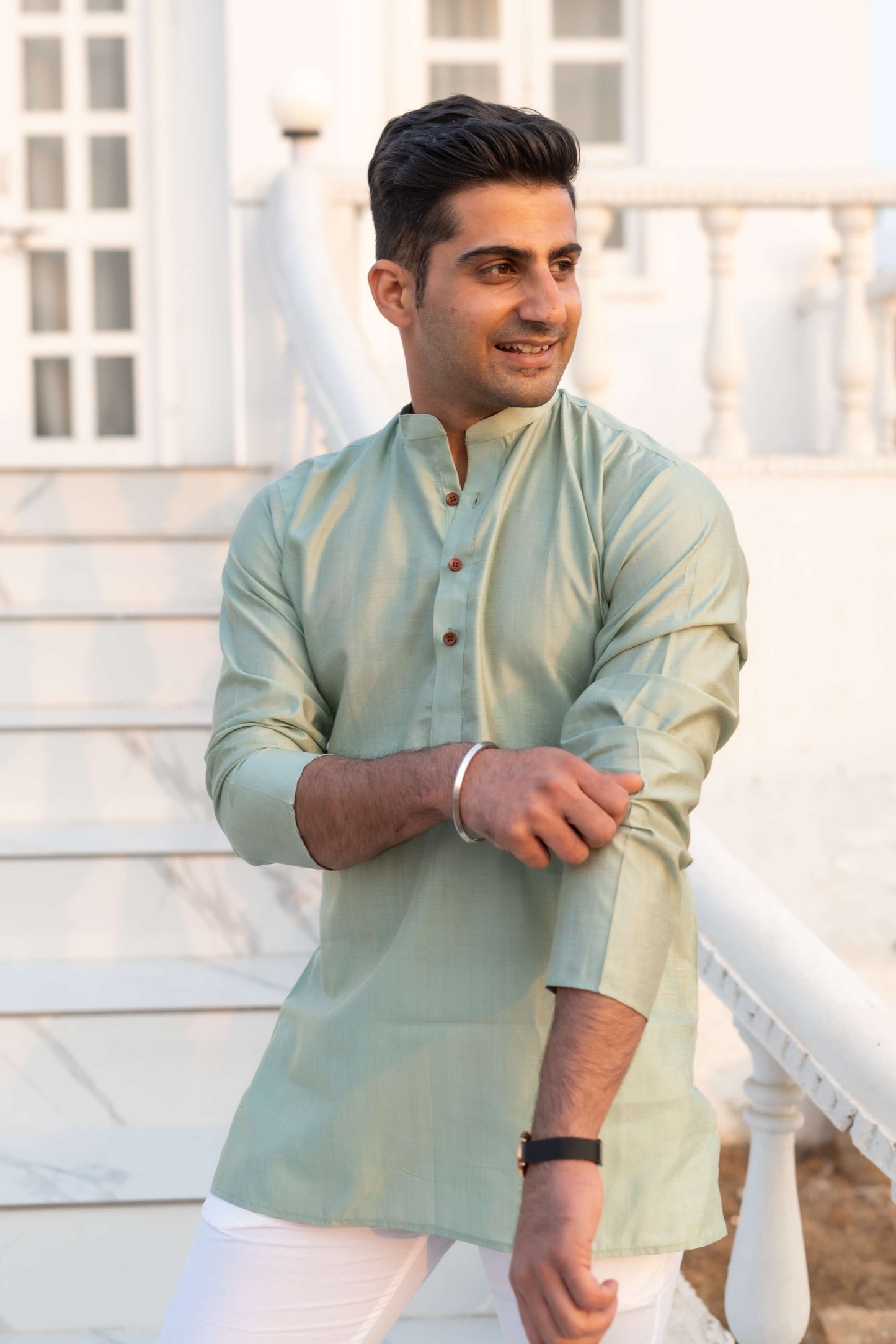 Indian man wearing sea green short kurta