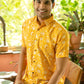 Indian man wearing yellow shirt