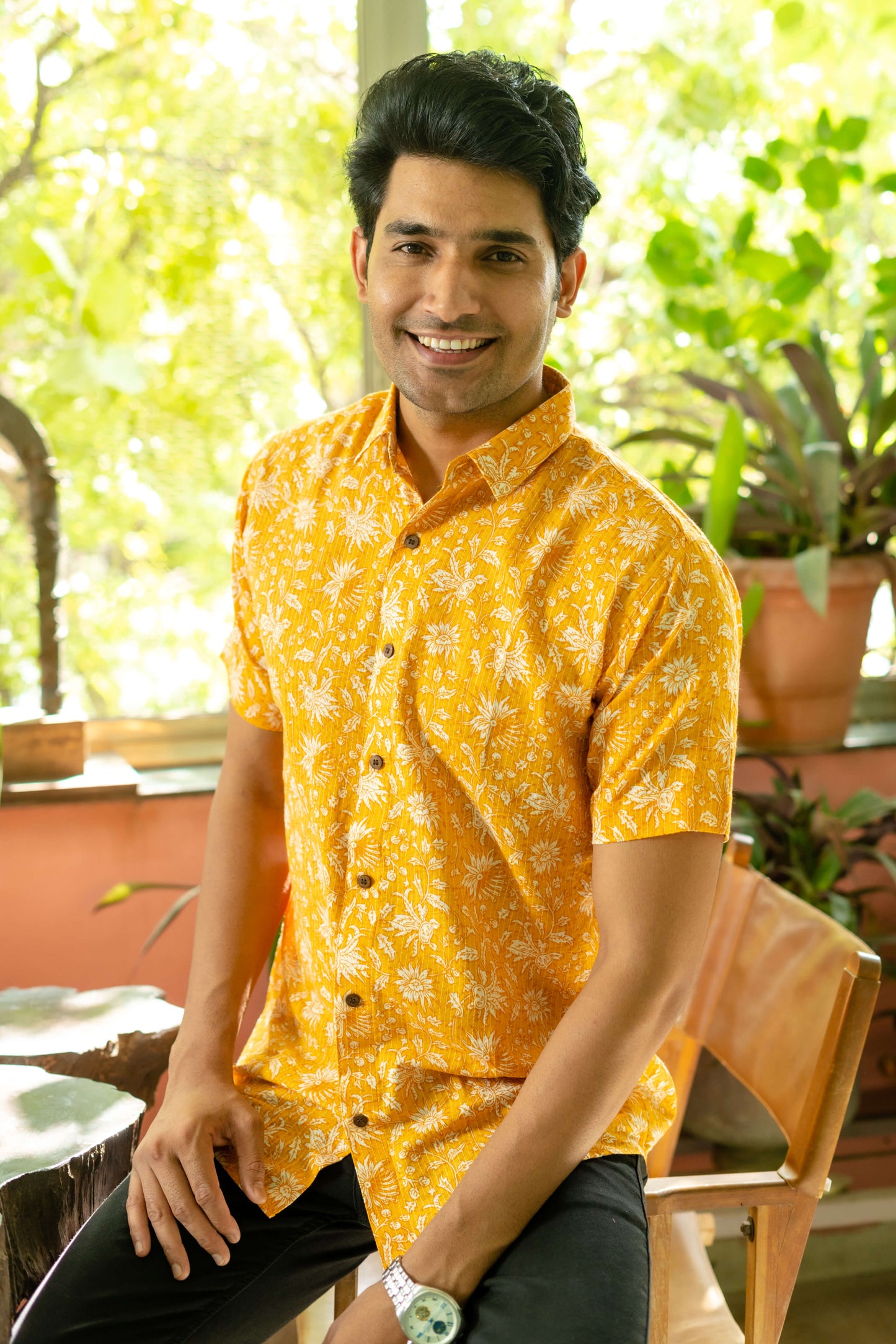 Indian man wearing yellow shirt