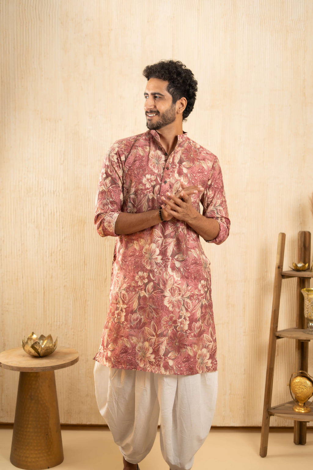 Man dressed in a floral wedding kurta and white dhoti