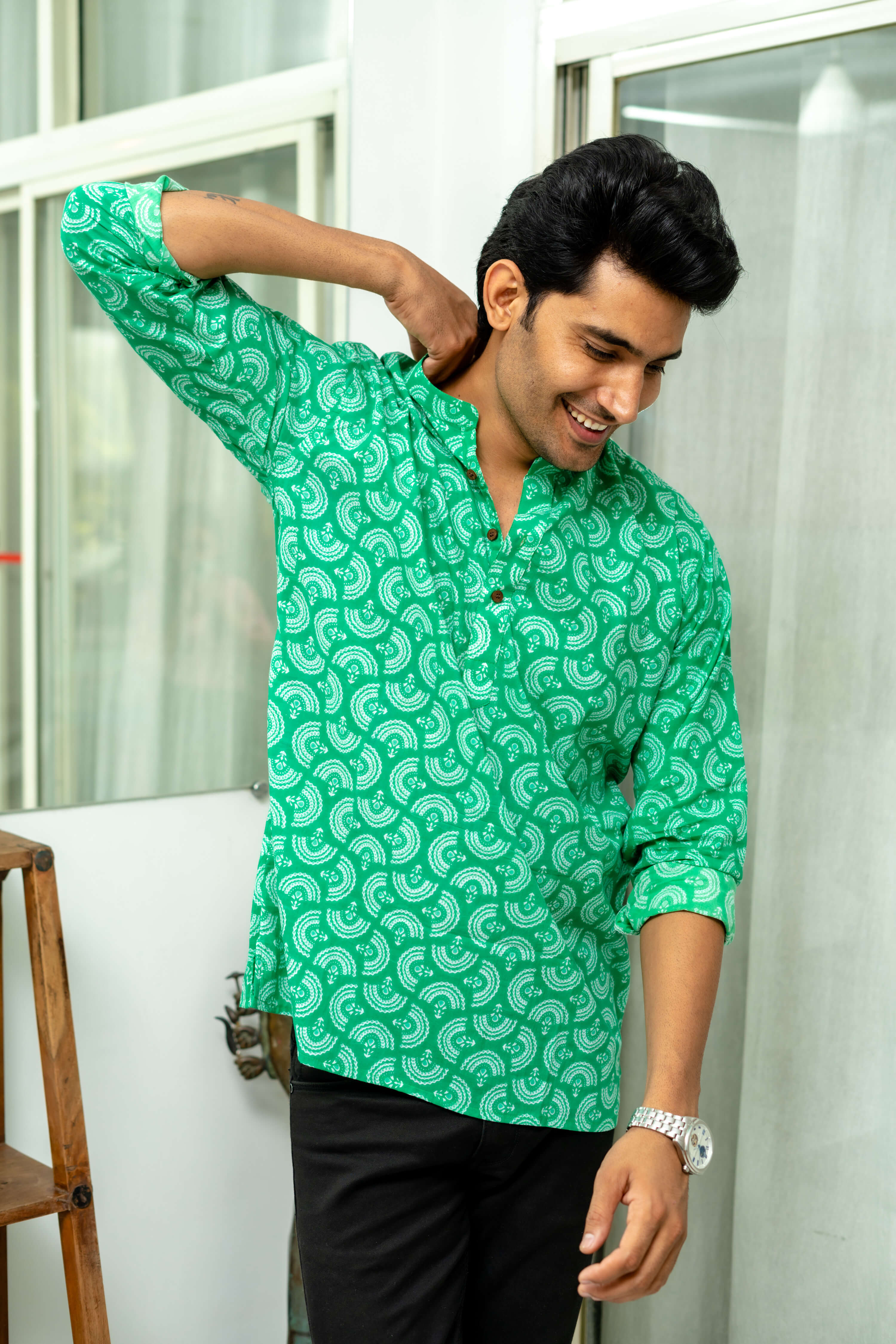 Indian man wearing green short kurta