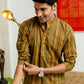 An Indian Men Wearing Mustard and Olive Green Tribal Stripe Print Short Kurta