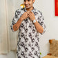 An Indian Men in Men's White Long Kurta With Floral Print
