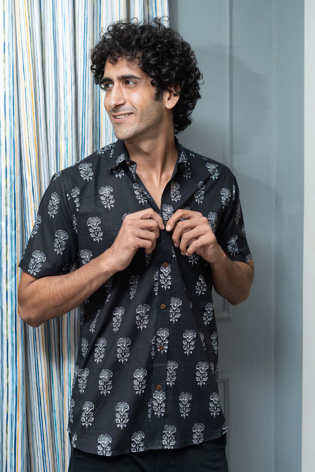 The Black Half Sleeves Shirt With White Flower Print