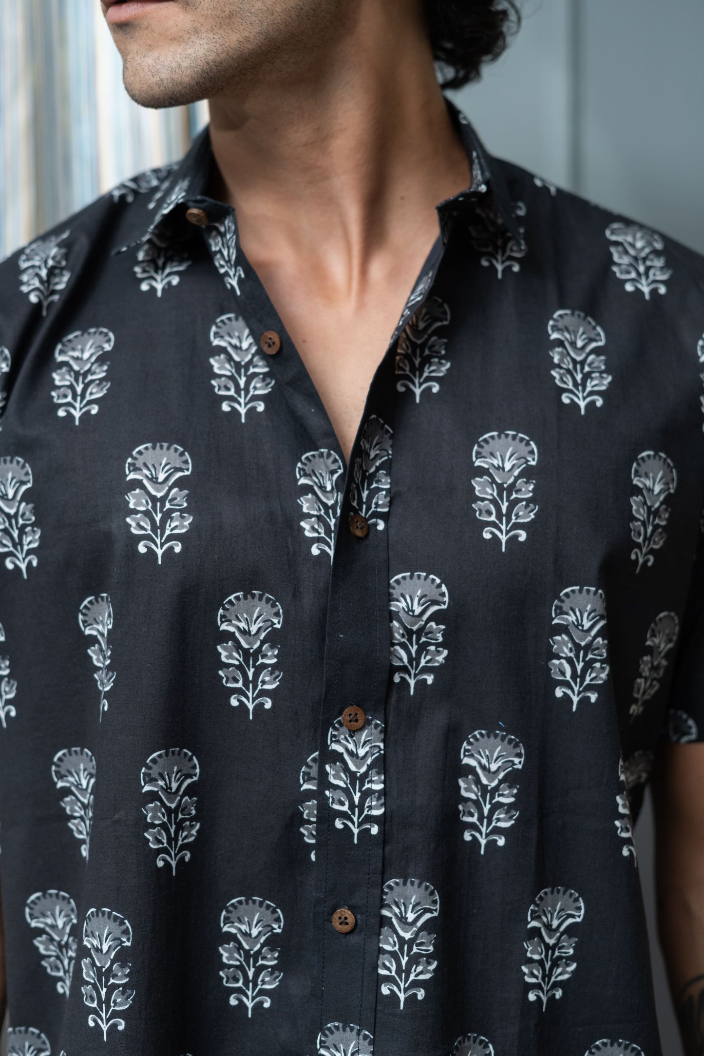 The Black Half Sleeves Shirt With White Flower Print