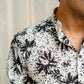 Close-up look of men's White long kurta with floral print