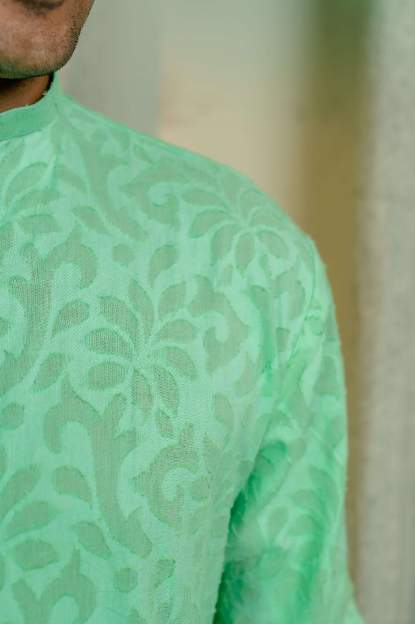 Green long kurta for men close-up look