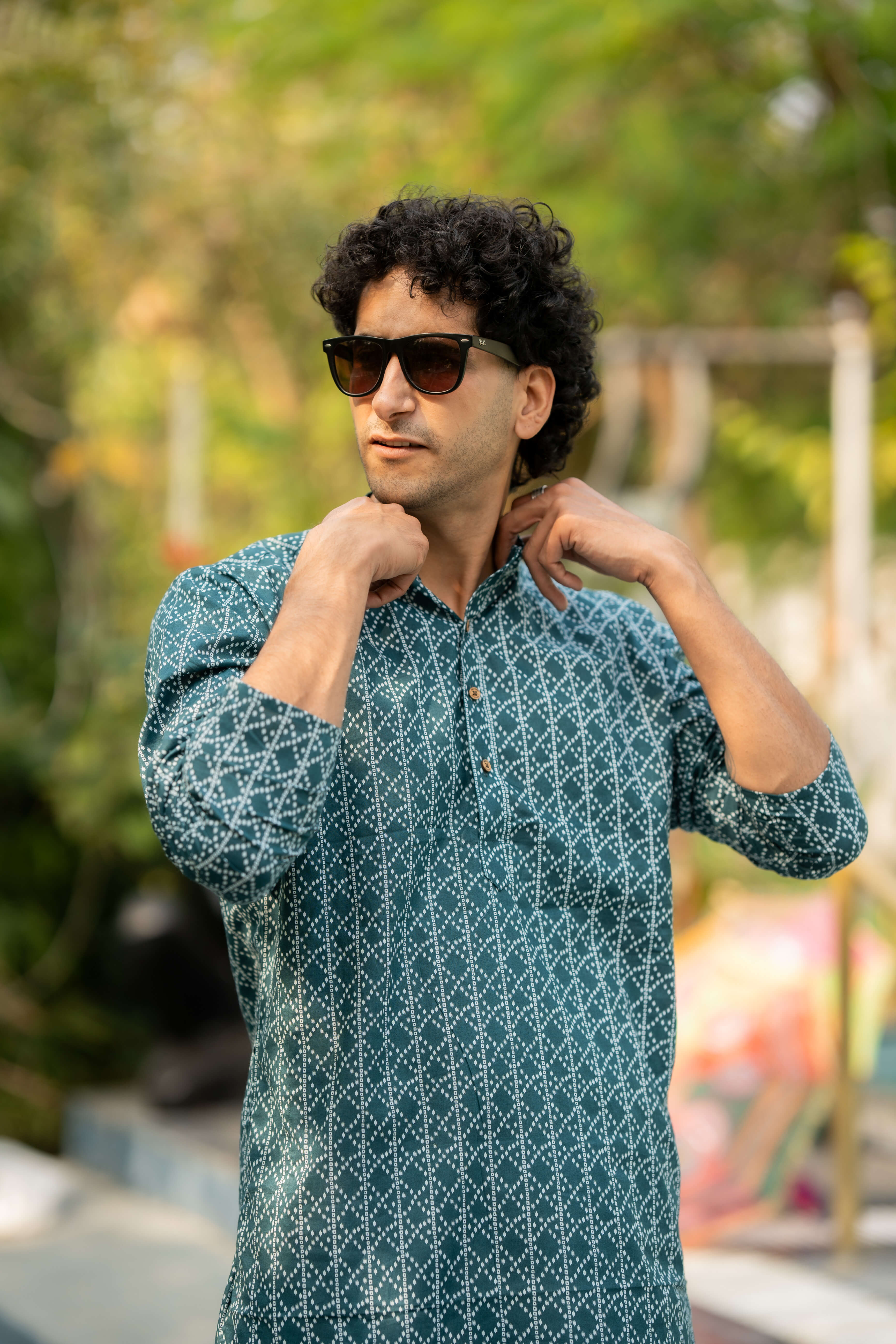 indian man in green long kurta