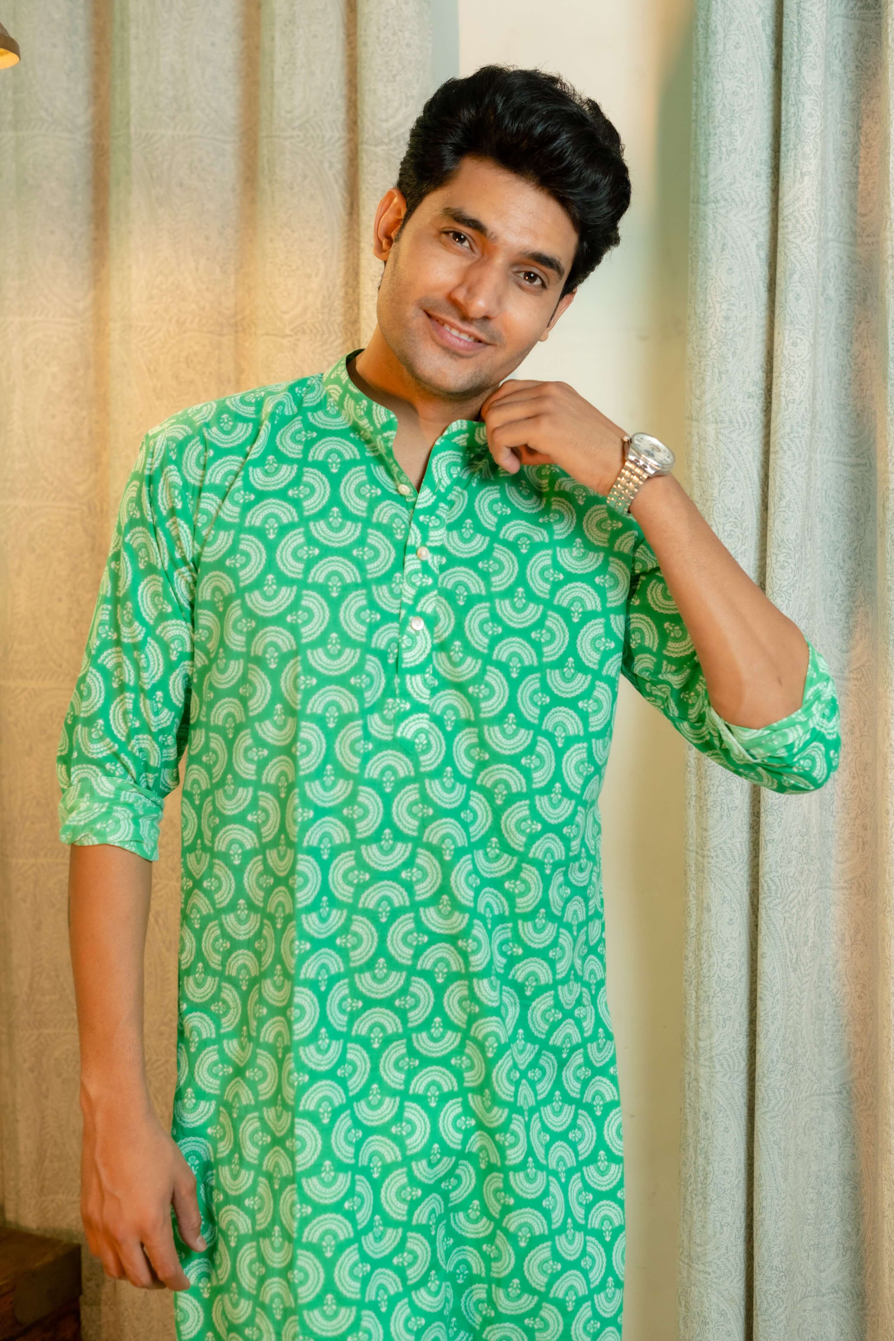 An Indian Man Wearing Green Long Kurta With Tribal Print