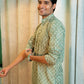 Indian man wearing green long kurta