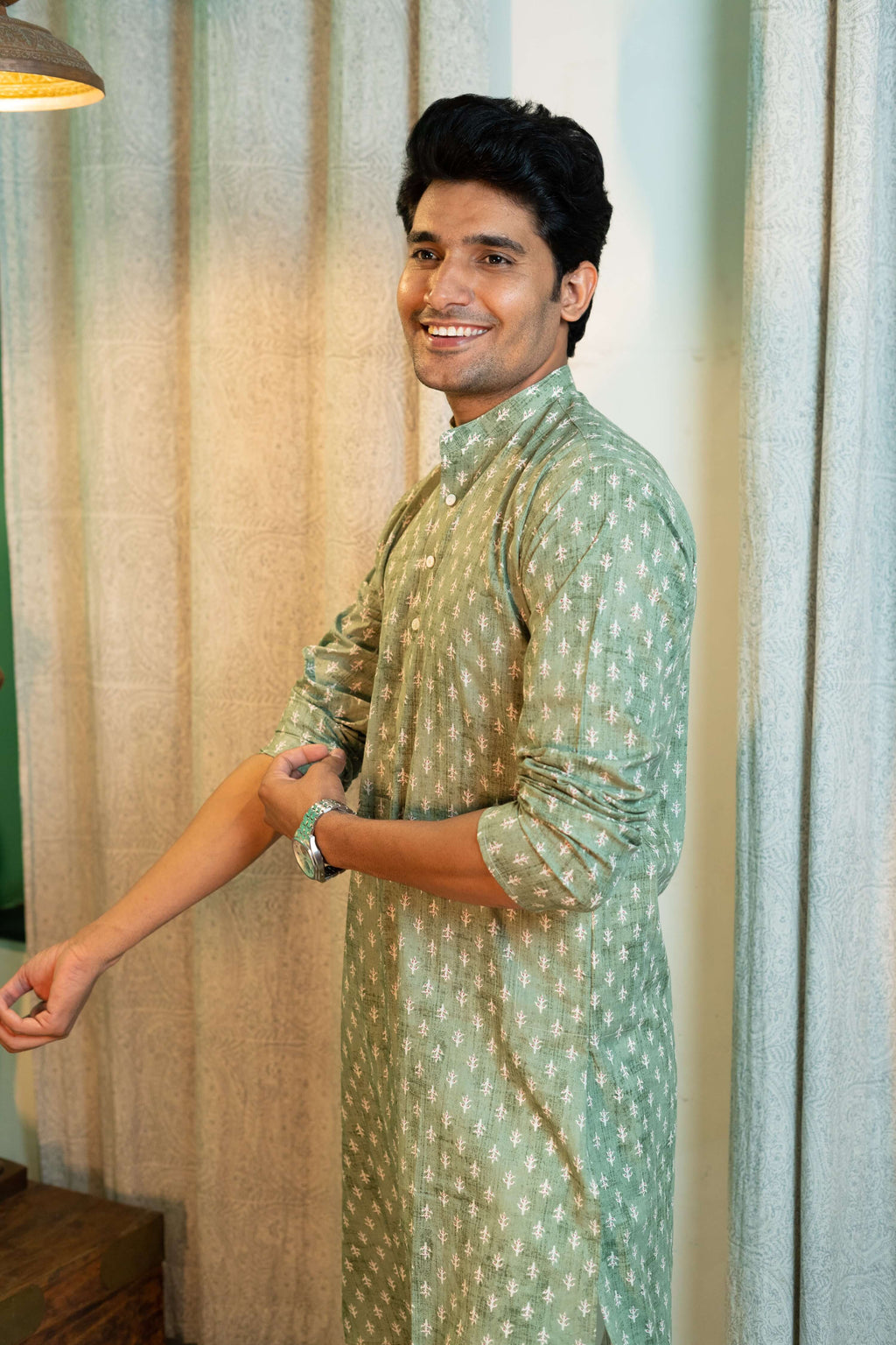 Indian man wearing green long kurta