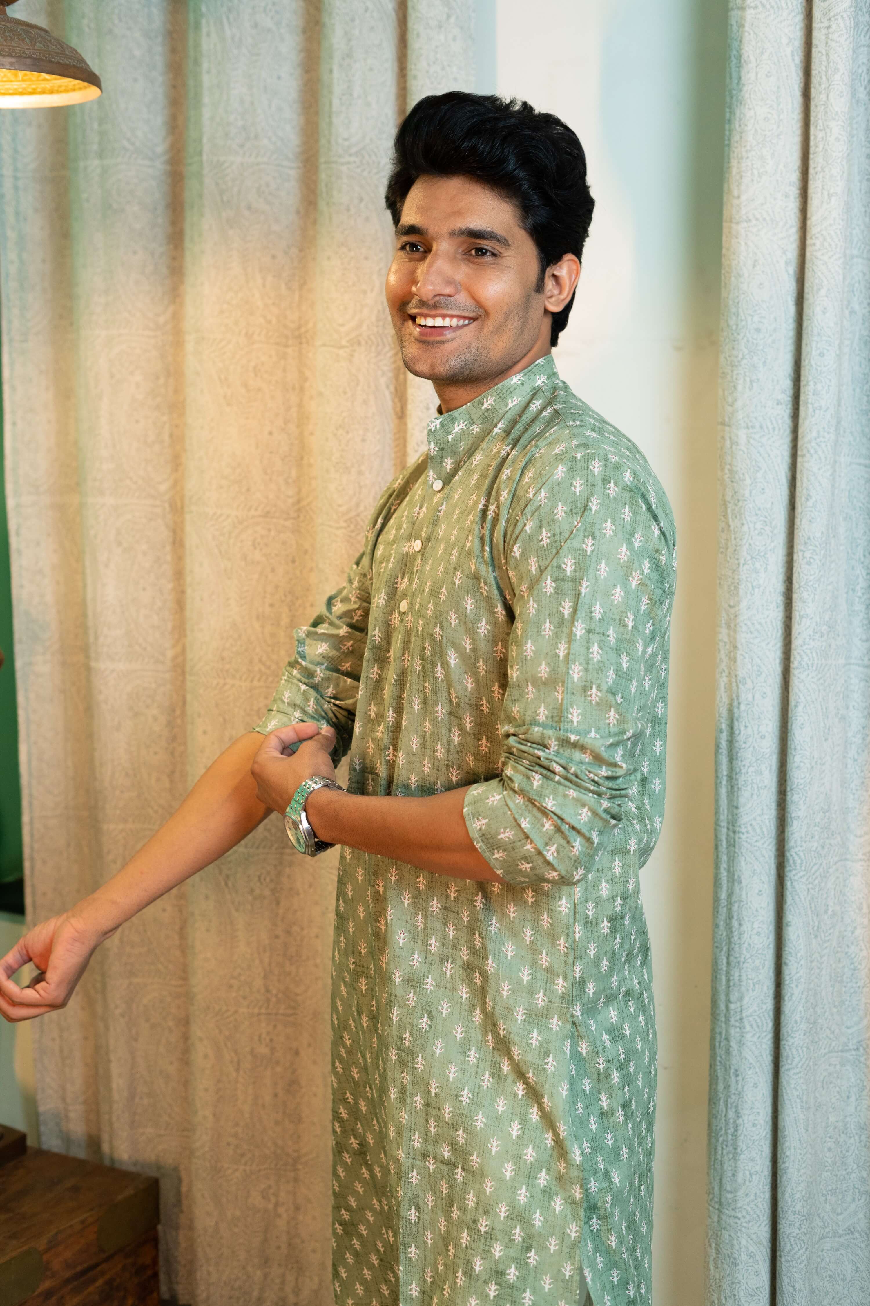 Indian man wearing green long kurta