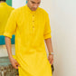Indian man wearing yellow long kurta