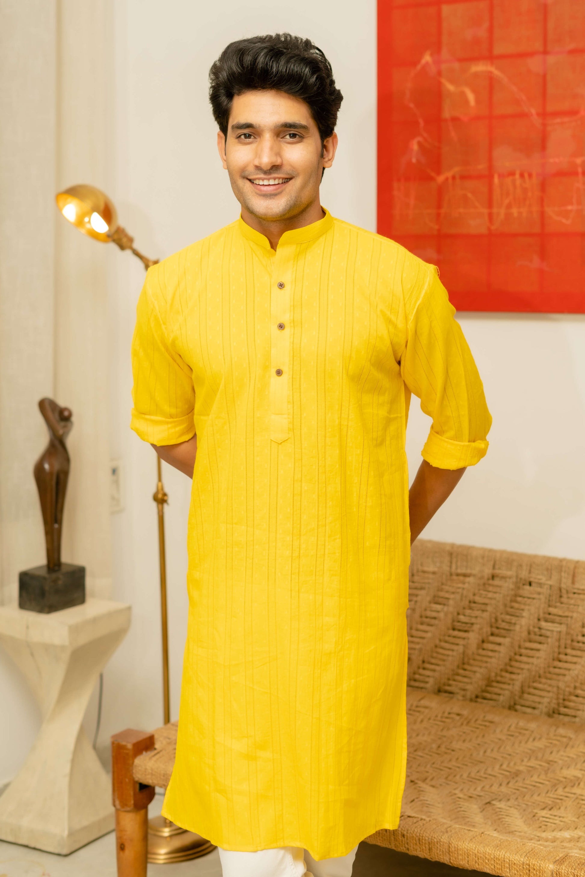 An Indian Man Wearing Yellow color Long Kurta 