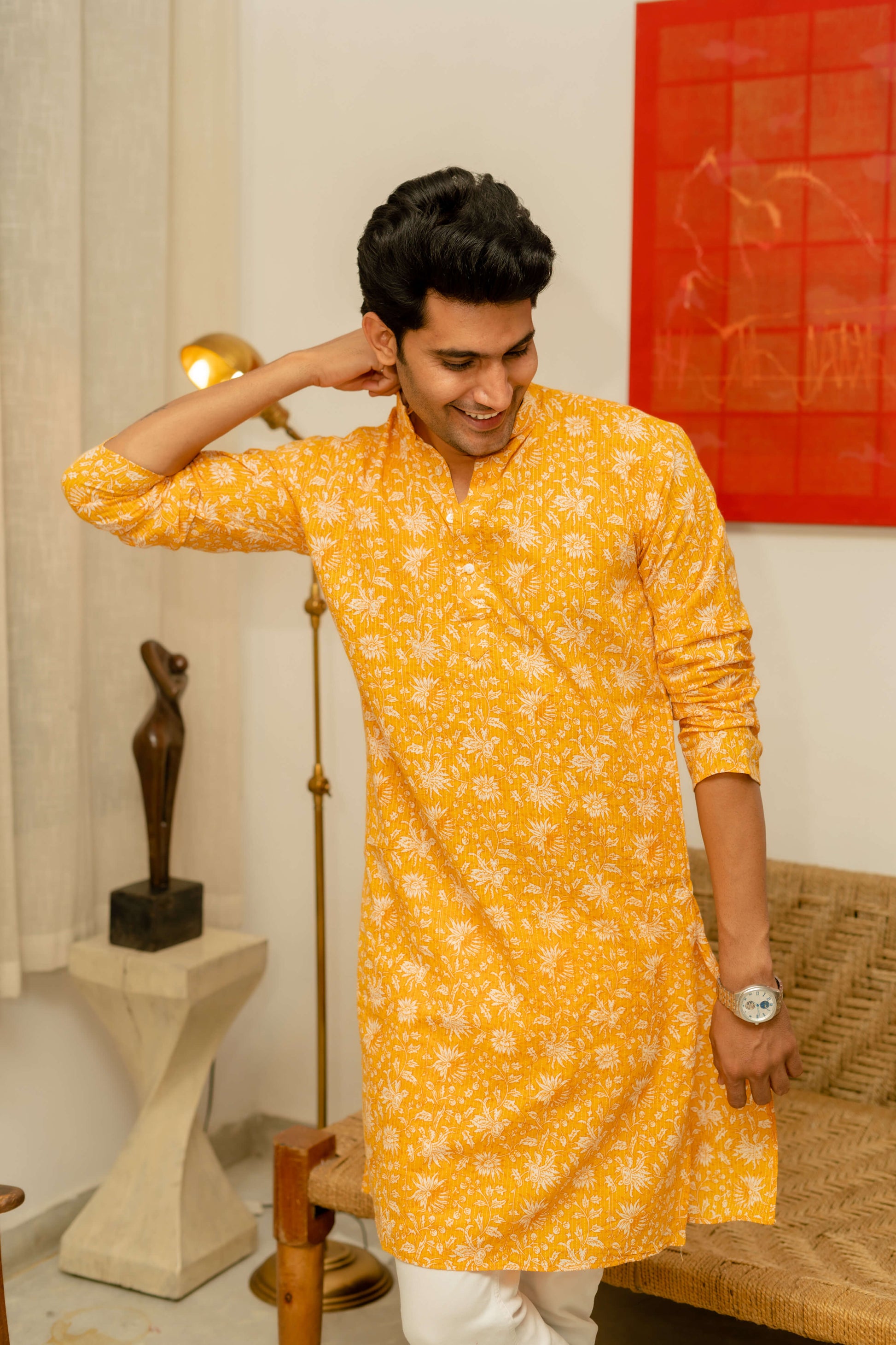 An Indian Man Wearing Yellow Kurta With Floral Print