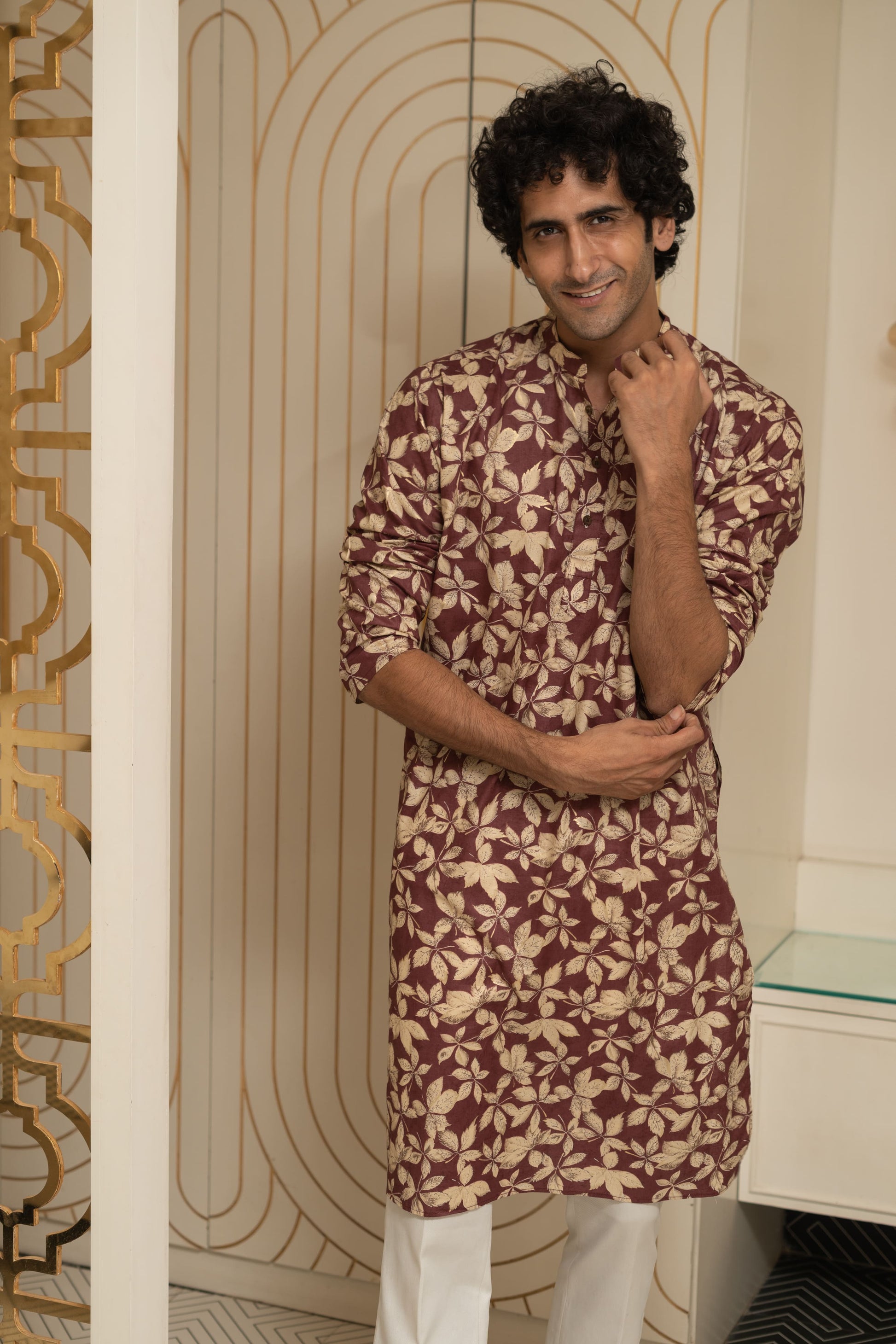 Indian man wearing maroon long kurta with floral print