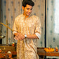 an Indian man wearing a brown color long kurta with an off-white floral print by shasak clothing