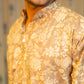 An Indian Man Wearing a Brown Color Long Kurta For Men With Off-White Floral Print Giving a Close-Up Look