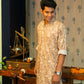 Man Giving Pose for  the Muslin Slub Long Kurta in Light Brown and Off-White Floral Print