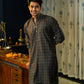 An India Man Wearing a Black Long With a Geometric Print Getting Ready For Diwali 