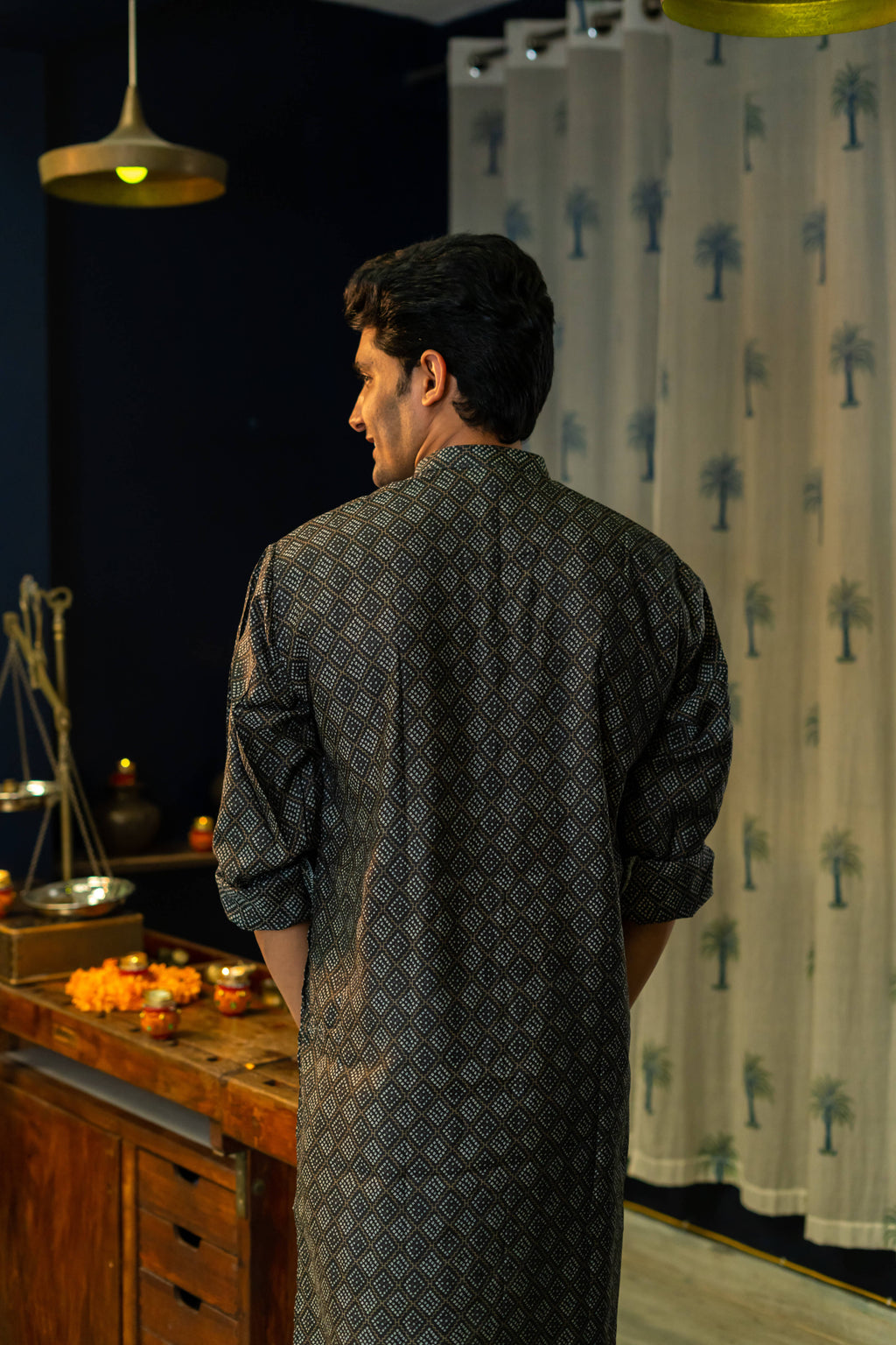 Back View of a Black Long Kurta For Men With a Geometric Print