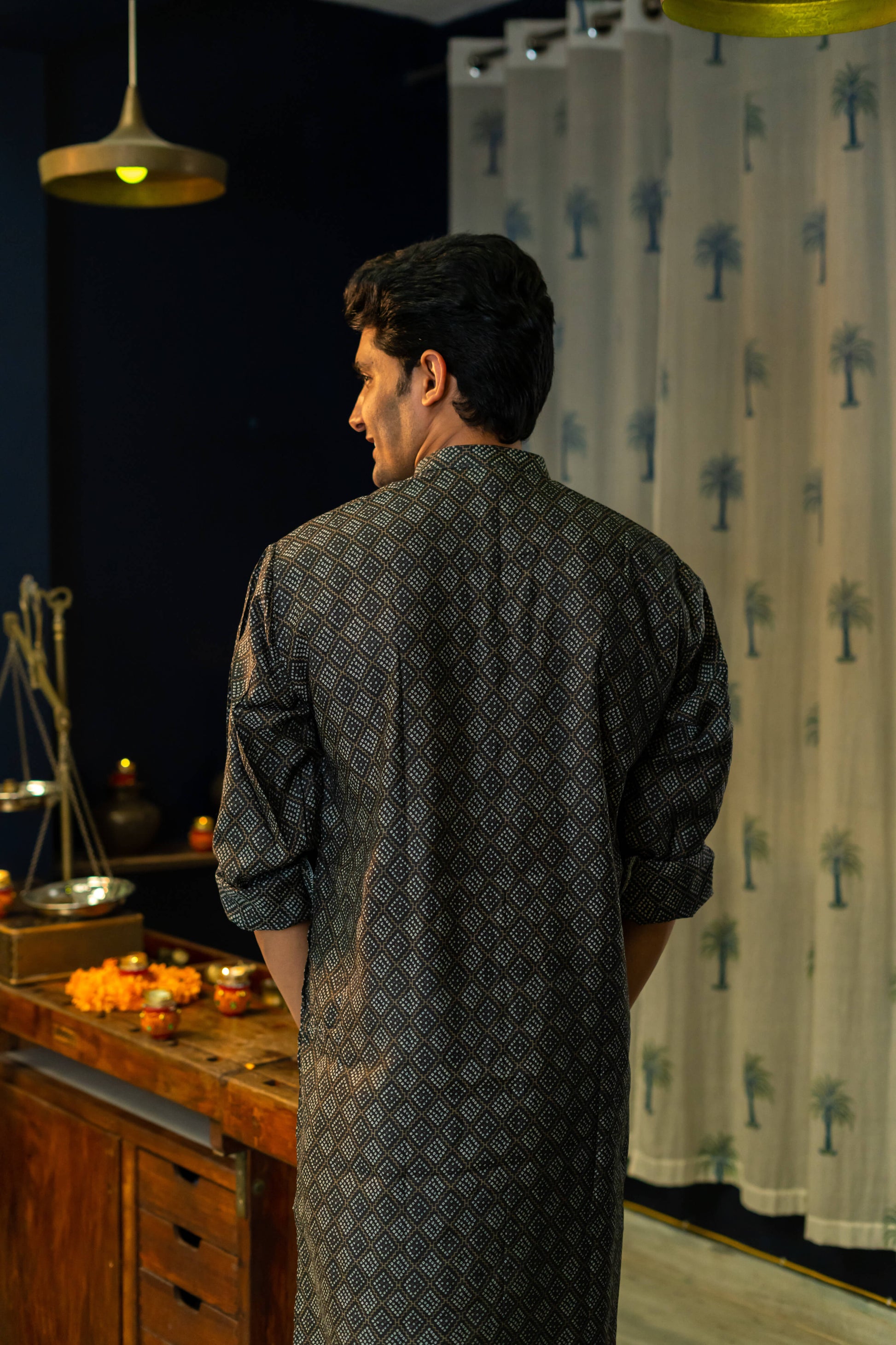 Back View of a Black Long Kurta For Men With a Geometric Print